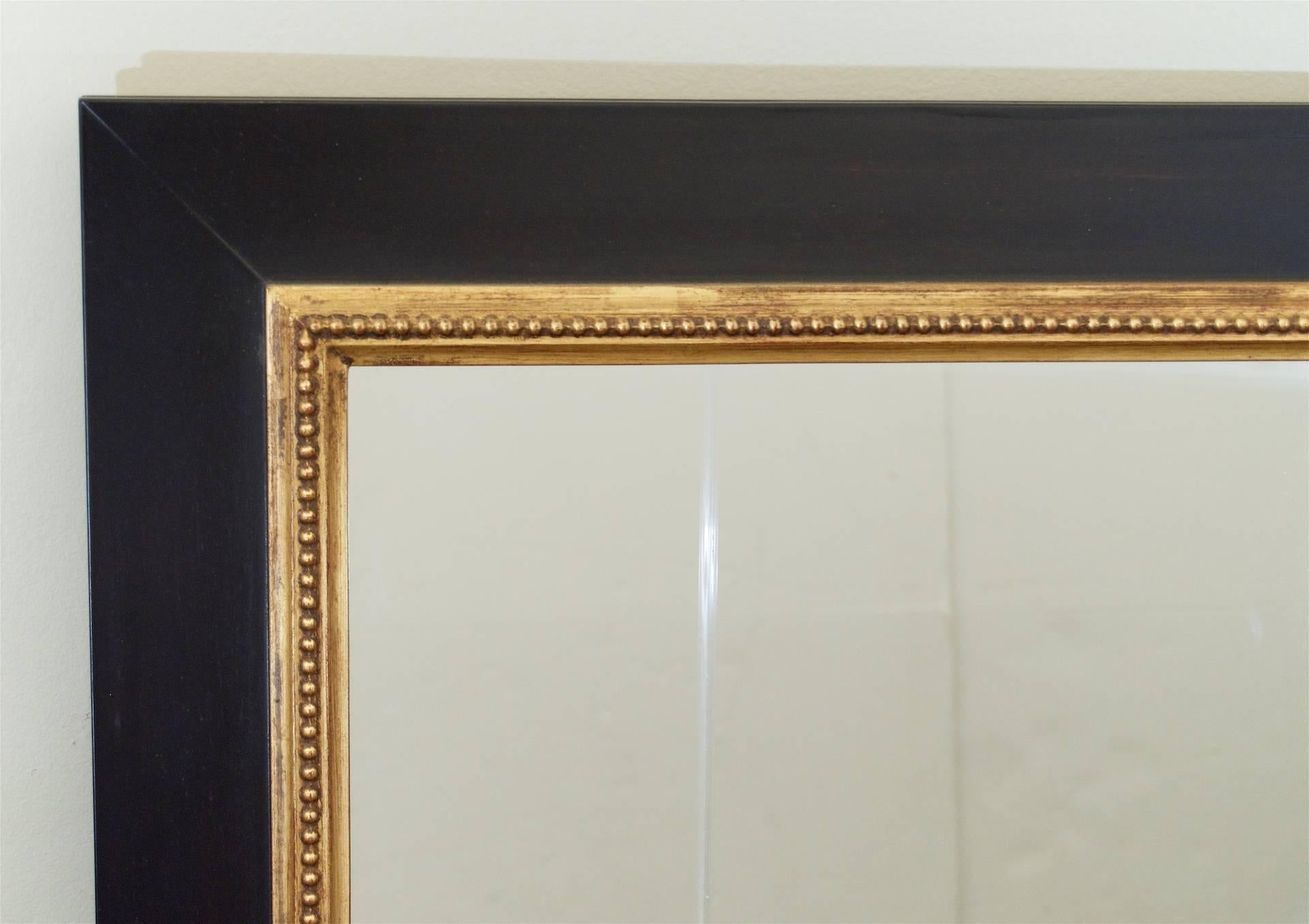 20th Century Ebonized Wall Mirror with Gold Details