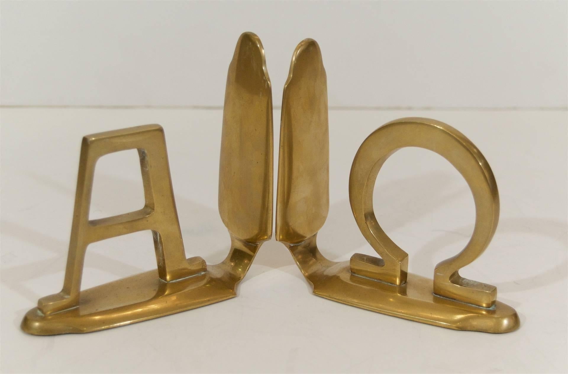 Pair of vintage brass bookends with the Greek letters for Alpha and Omega (beginning and end).