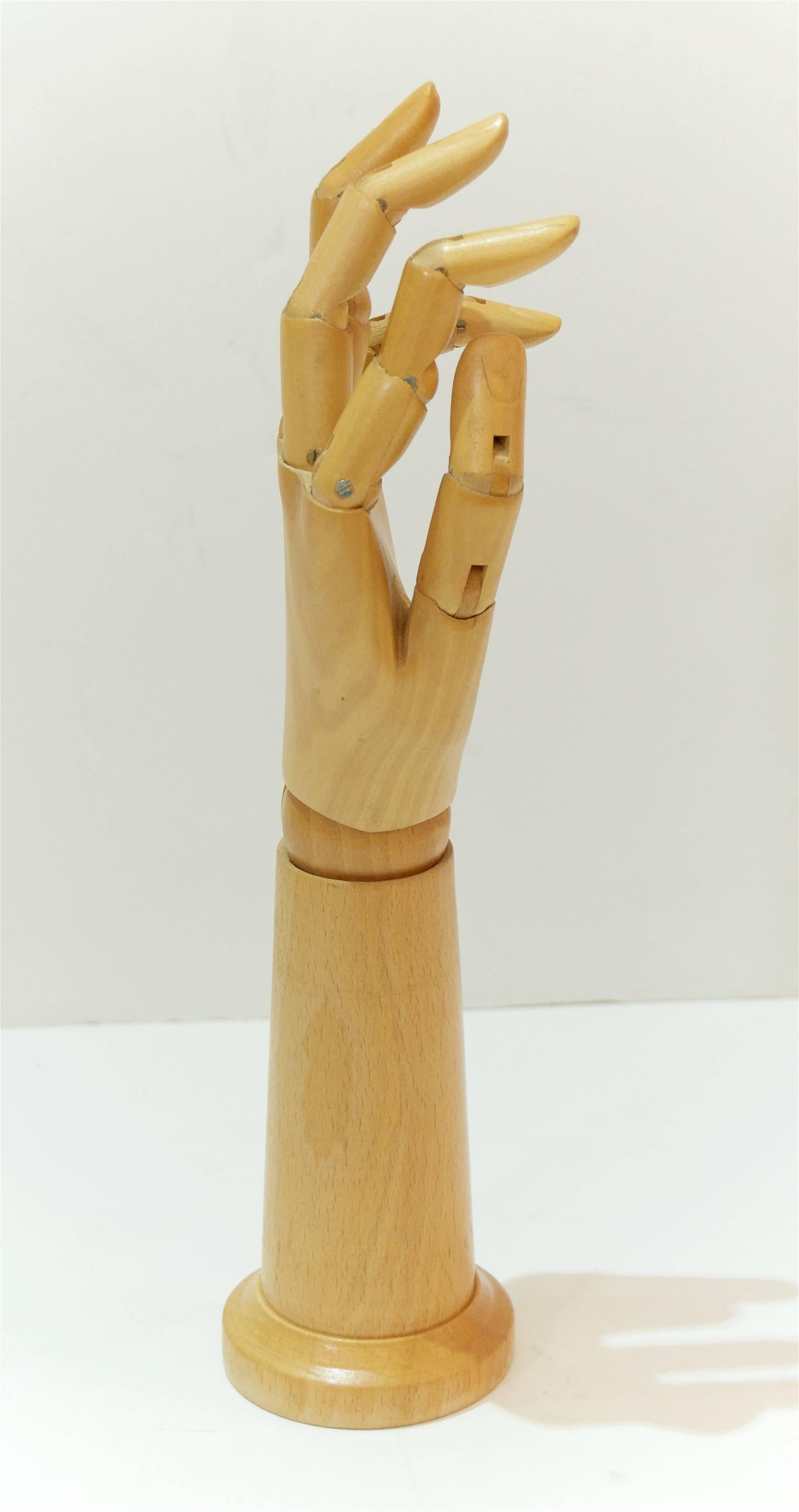 Beautiful Mid-Century articulated model hand used by artists.

Measurements are of hand fully extended.