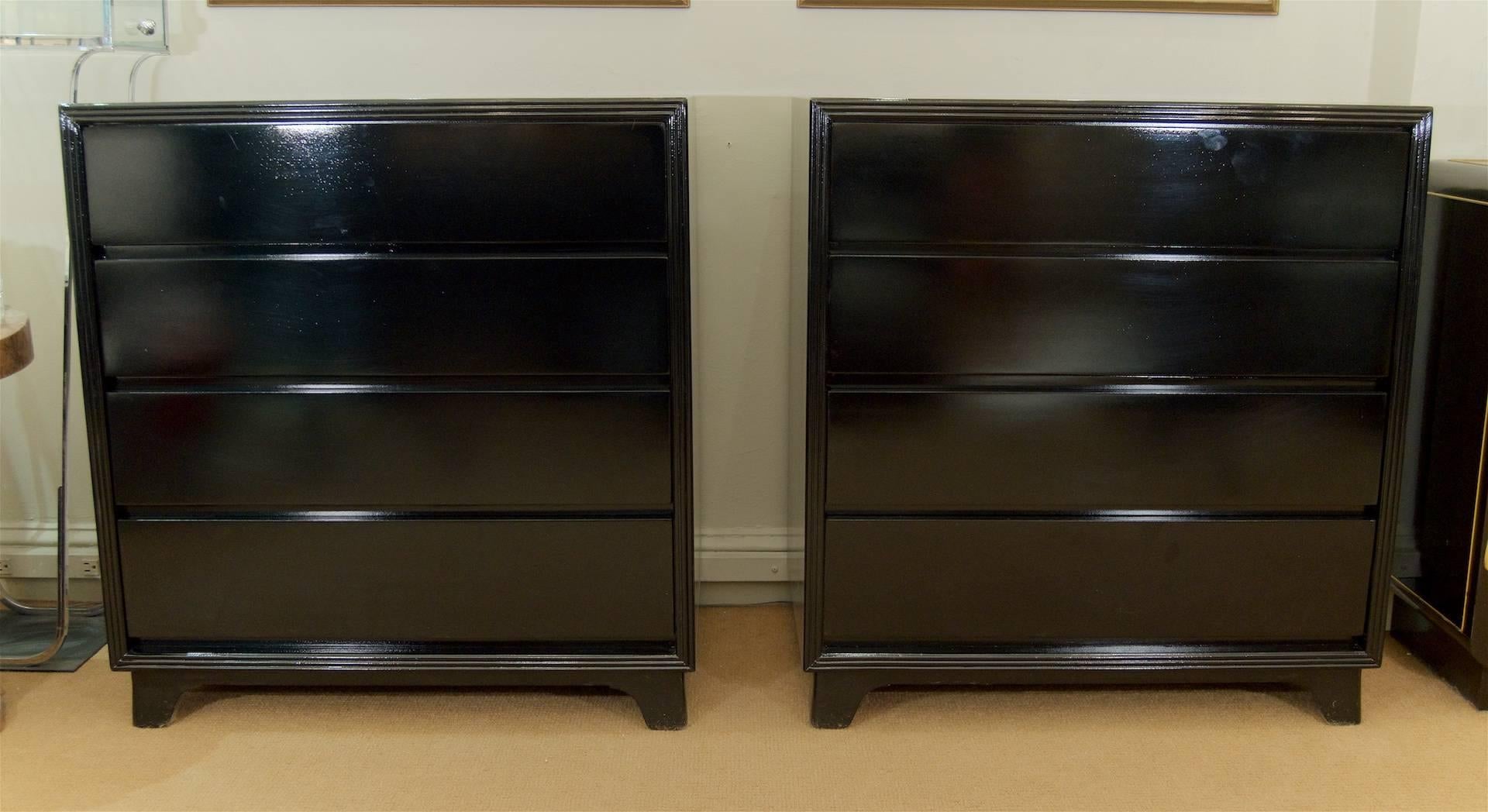 Well-sized pair of bachelor's chests or bedside end tables, each with four drawers (recessed finger pulls on underside of drawer fronts. The gloss black lacquer emphasizes the clean lines and proportions, with a minimal border mold on the face of