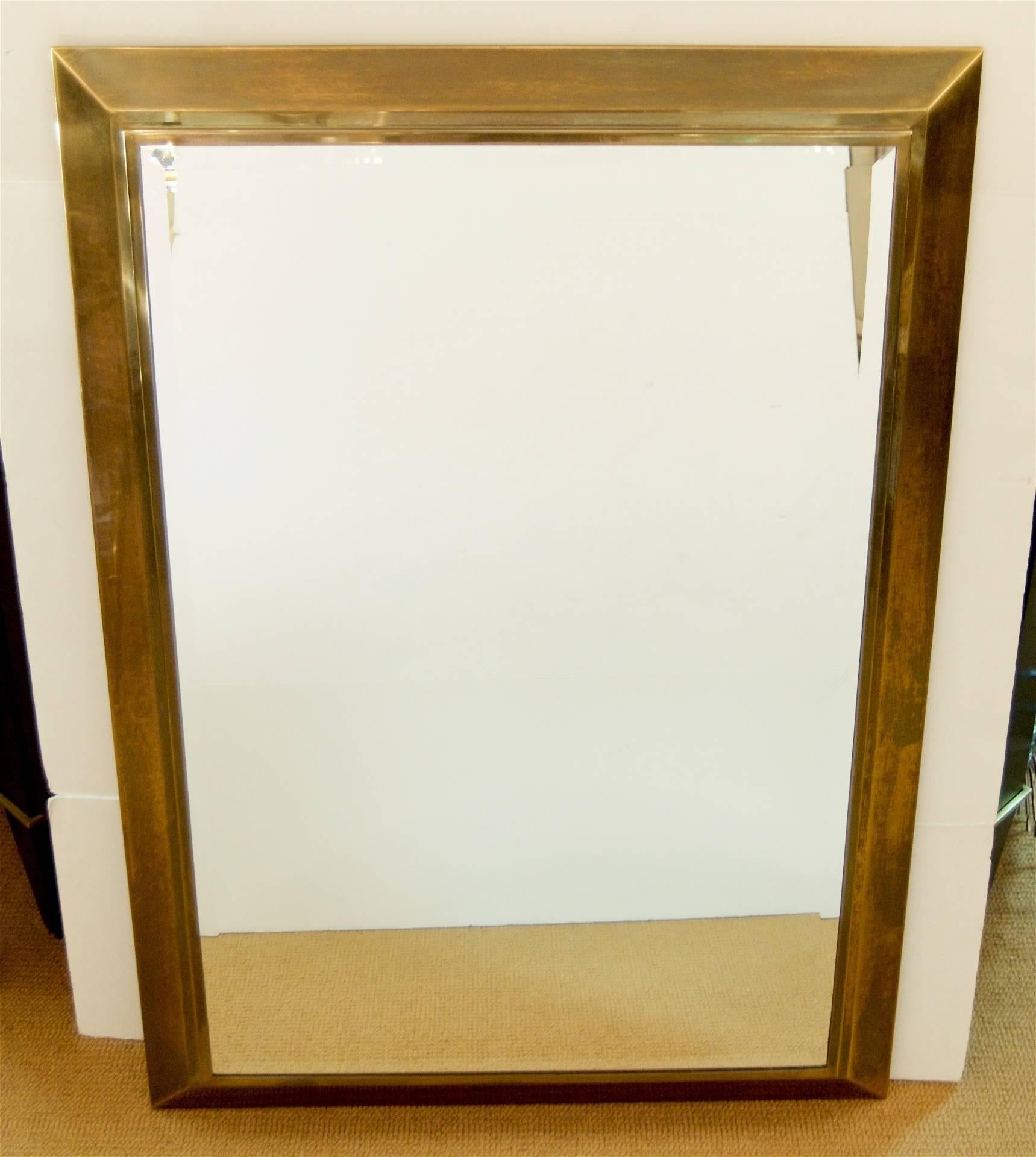 Simple brass angle framed La Barge mirror with bevelled mirror.