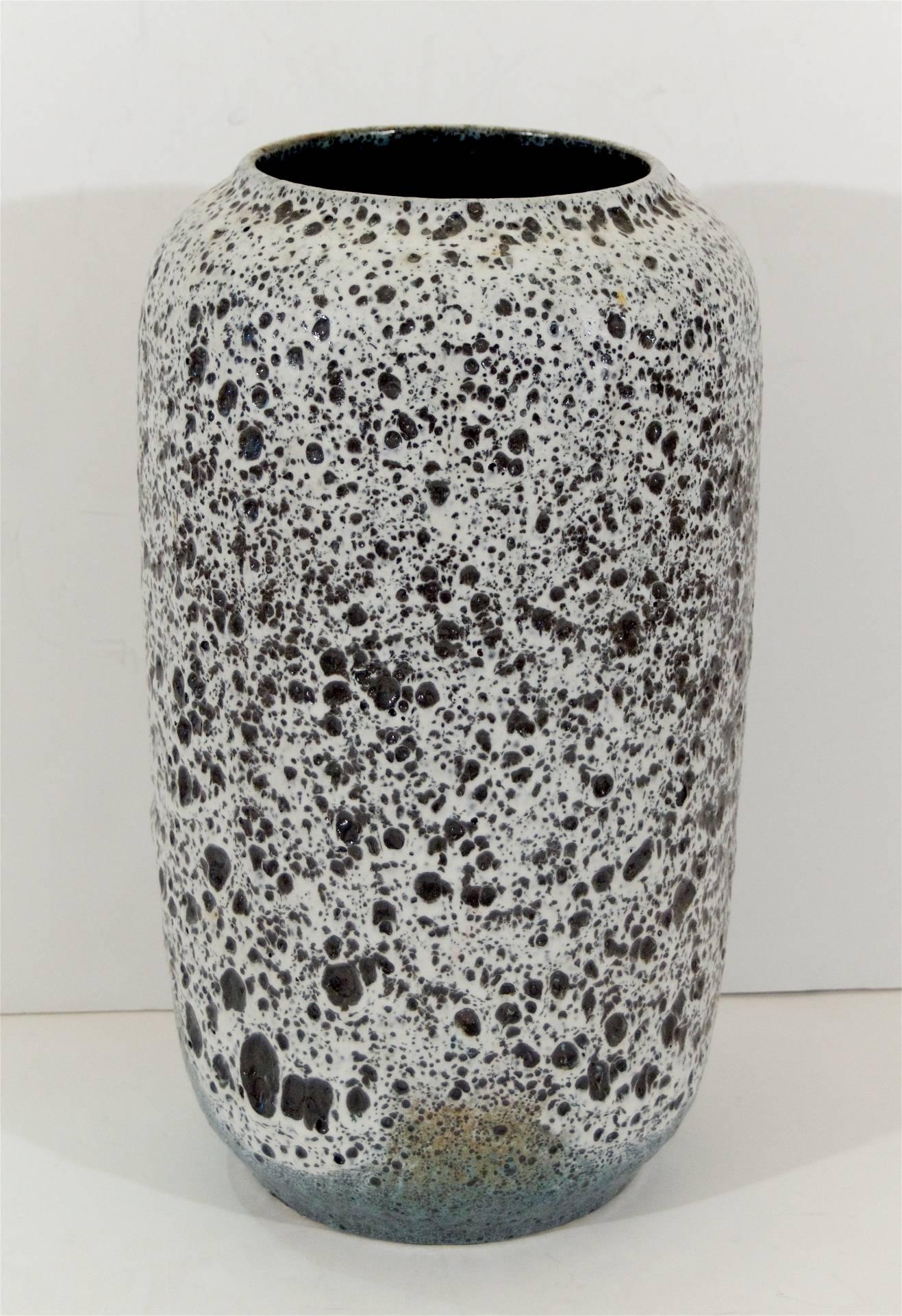Uniquely patterned and well-formed ceramic vase by Scheurich Keramik. A dramatically heavy glazing texture with deep cratering, resembling the surface of pumice in a blend of deep earth tones, a white higher texture, and a sea foam accent glazing at