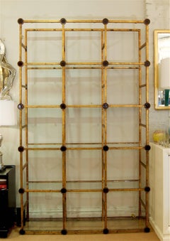 Massive Gilt Metal Étagère with Garnet Tone Glass Medallions