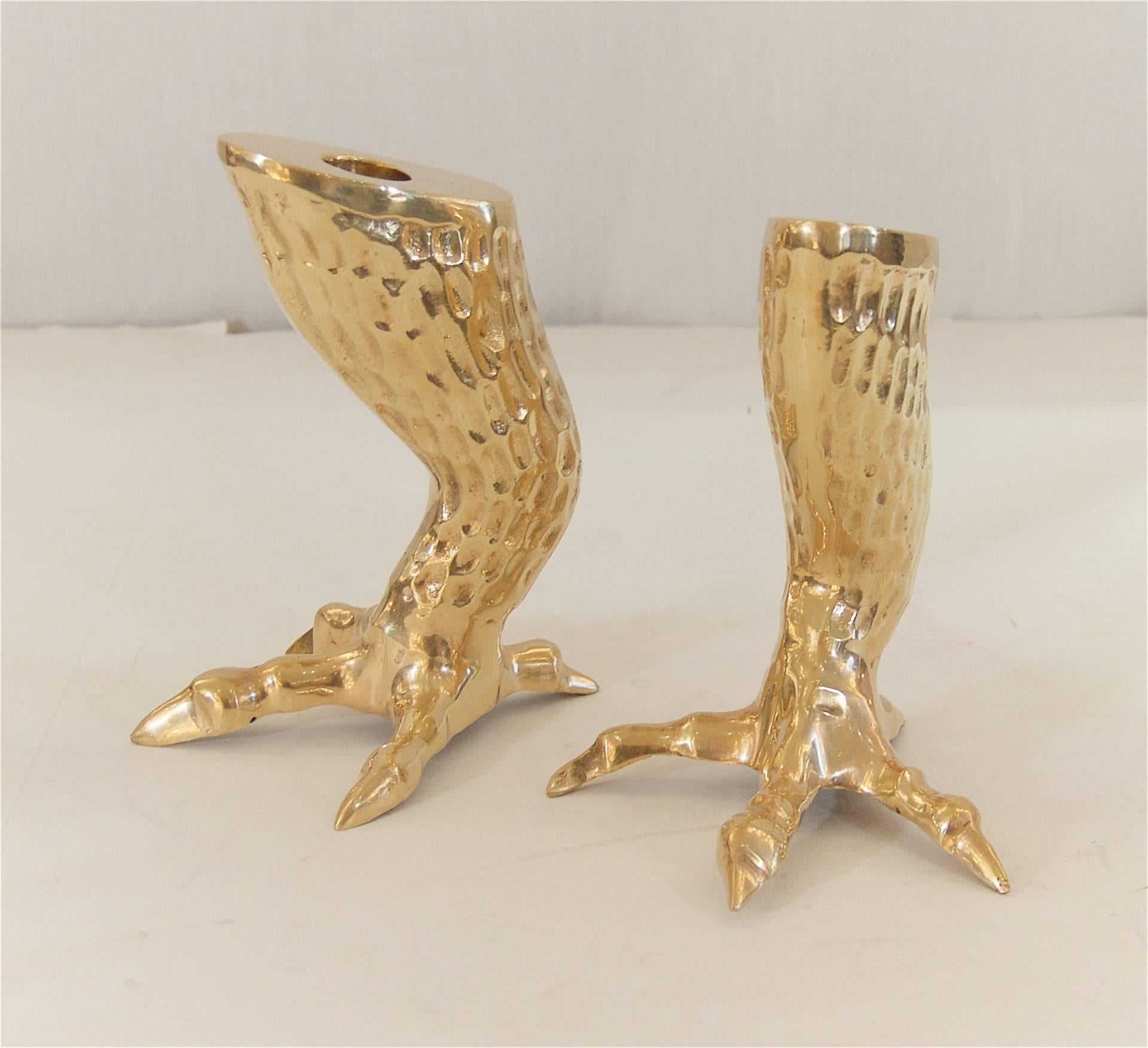 Pair of brass candlestick holders in the shape of eagle's talons. The detailing on them make an excellent addition to any table.