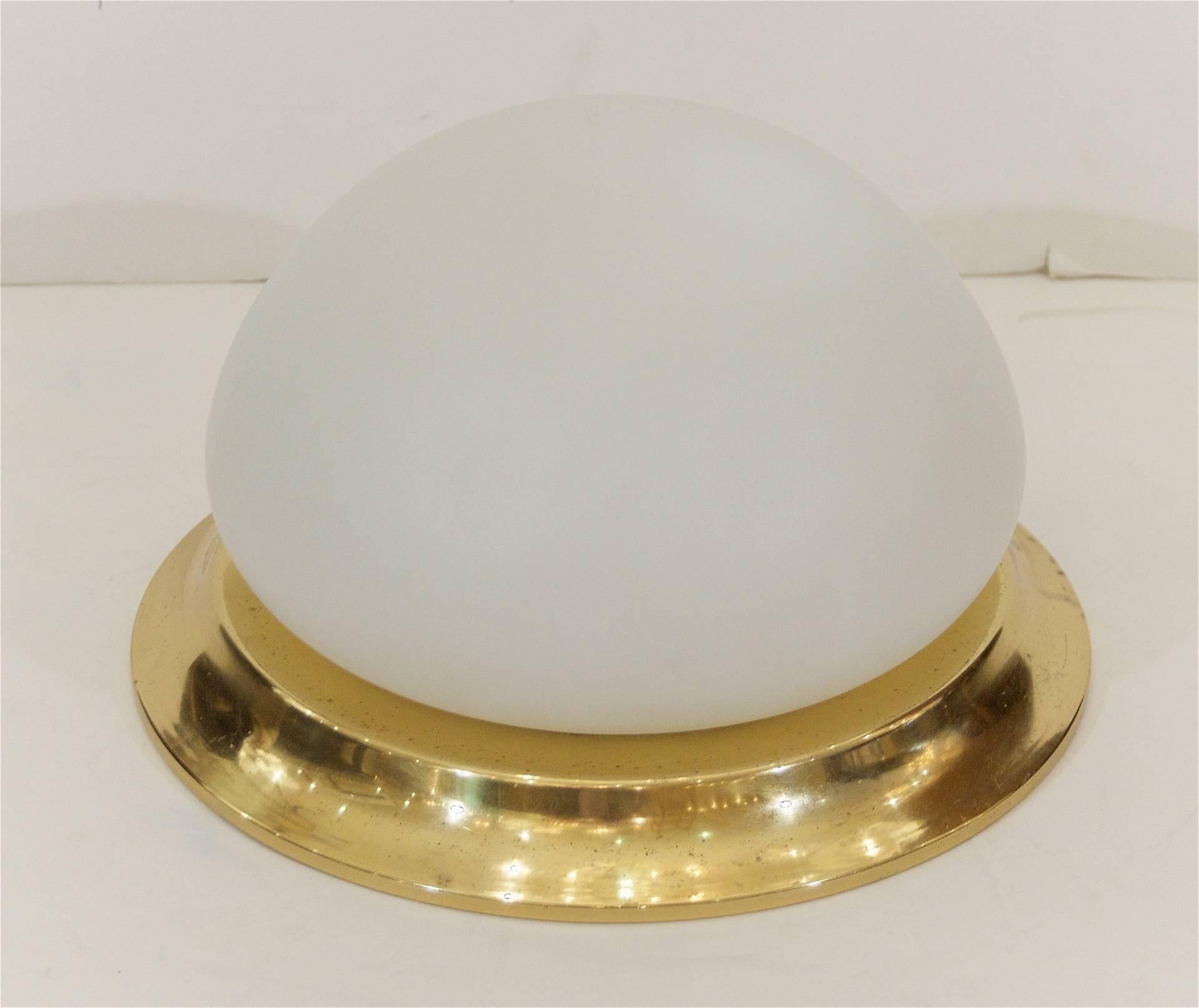 Well sized domed opal glass flush mount with a brass surround. 

Takes one medium base bulbs up to 60 watts per bulb. New wiring. 

Price listed is per fixture. Two available.