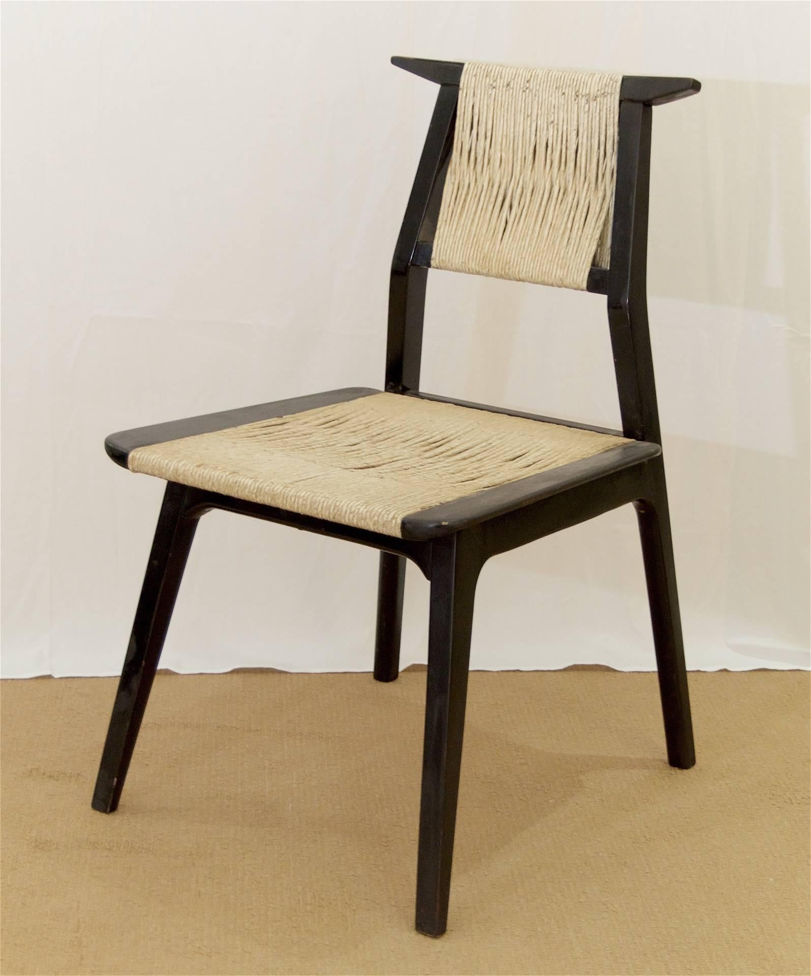 Geometric Mid-Century Danish chair, the wooden frame in satin black lacquer and the seat and back with cord-wrapped supports.

In as-is condition - please see condition notes.