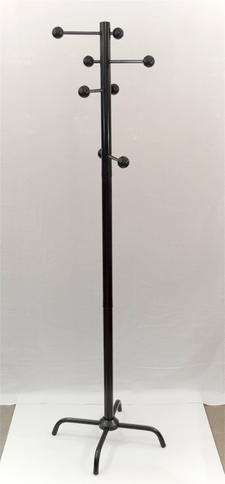 Black enameled metal Mid-Century Modern Italian coat tree. Arms slide through post for varying depth. Balls at end of arms are plastic.

Also available in red on separate listing.