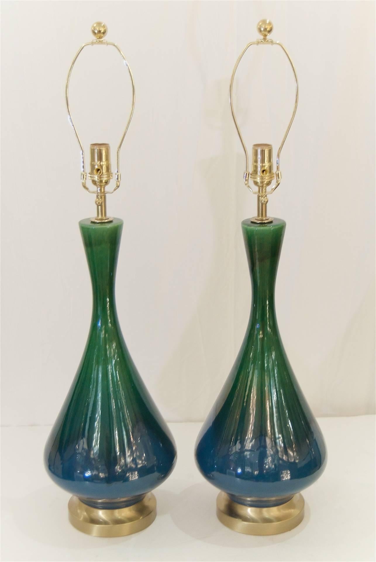 Excellent pair of elegantly formed Mid-Century glazed ceramic lamps with brushed brass hardware by Royal Haeger. 

New wiring. Lamp shades are for display purposes only and are not included. 

New sockets and wiring. Overall height to the top of the