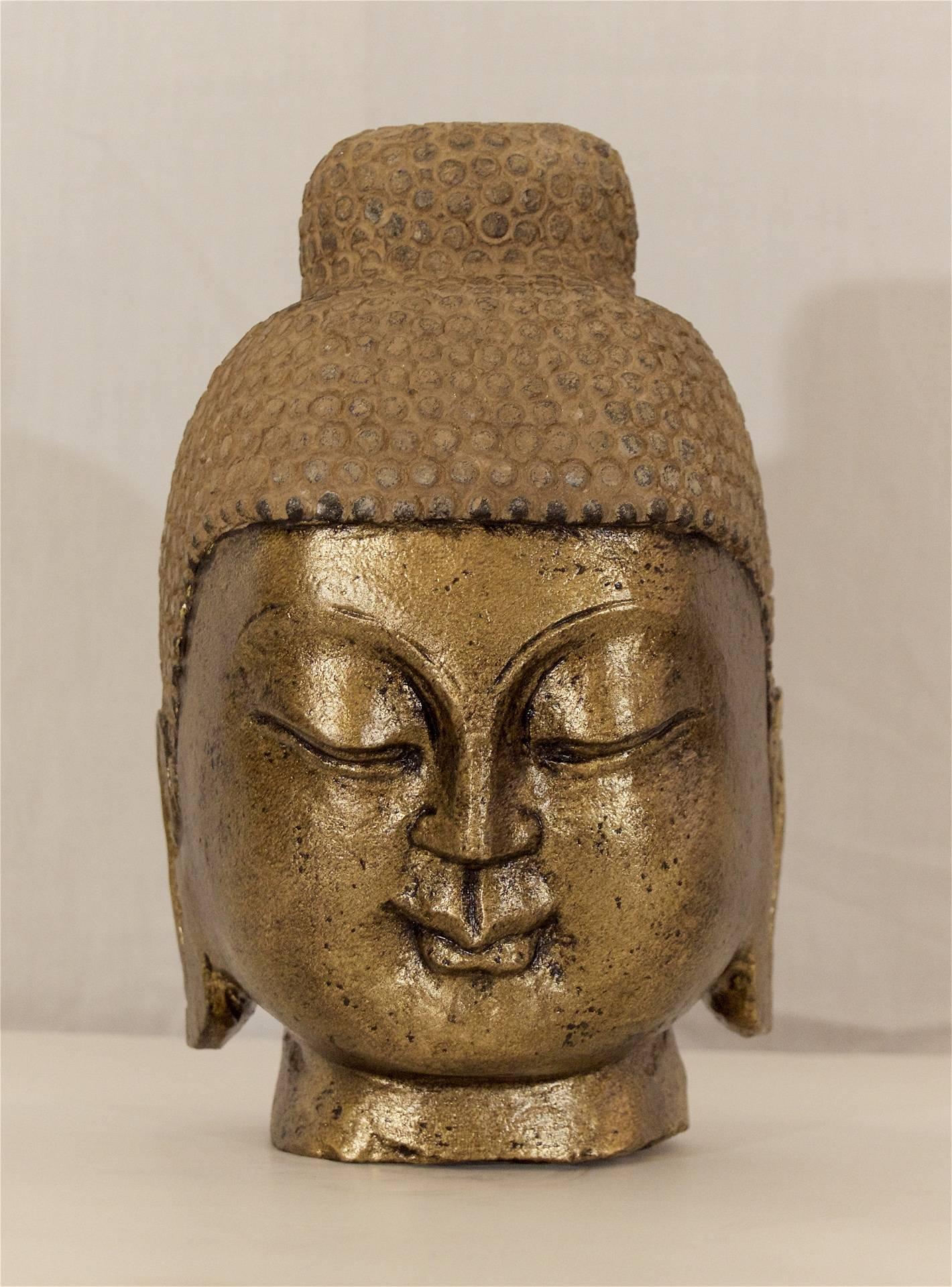 Excellent Buddha head of carved stone with recently gilt face.

Uncertain age of creation, no later than early 20th century.