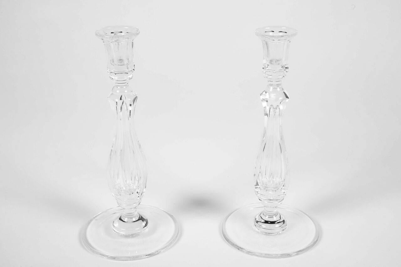 Pair of 19th century cut crystal hurricanes with candlesticks cast and warm.