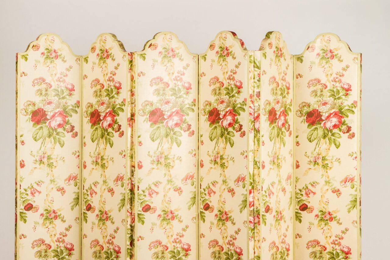 Pretty upholstered screen or room divider. 20th century Colefax and Fowler glazed chintz with silk trim edging. From the Estate of Pamela Churchill Harriman.

Each panel measures 12