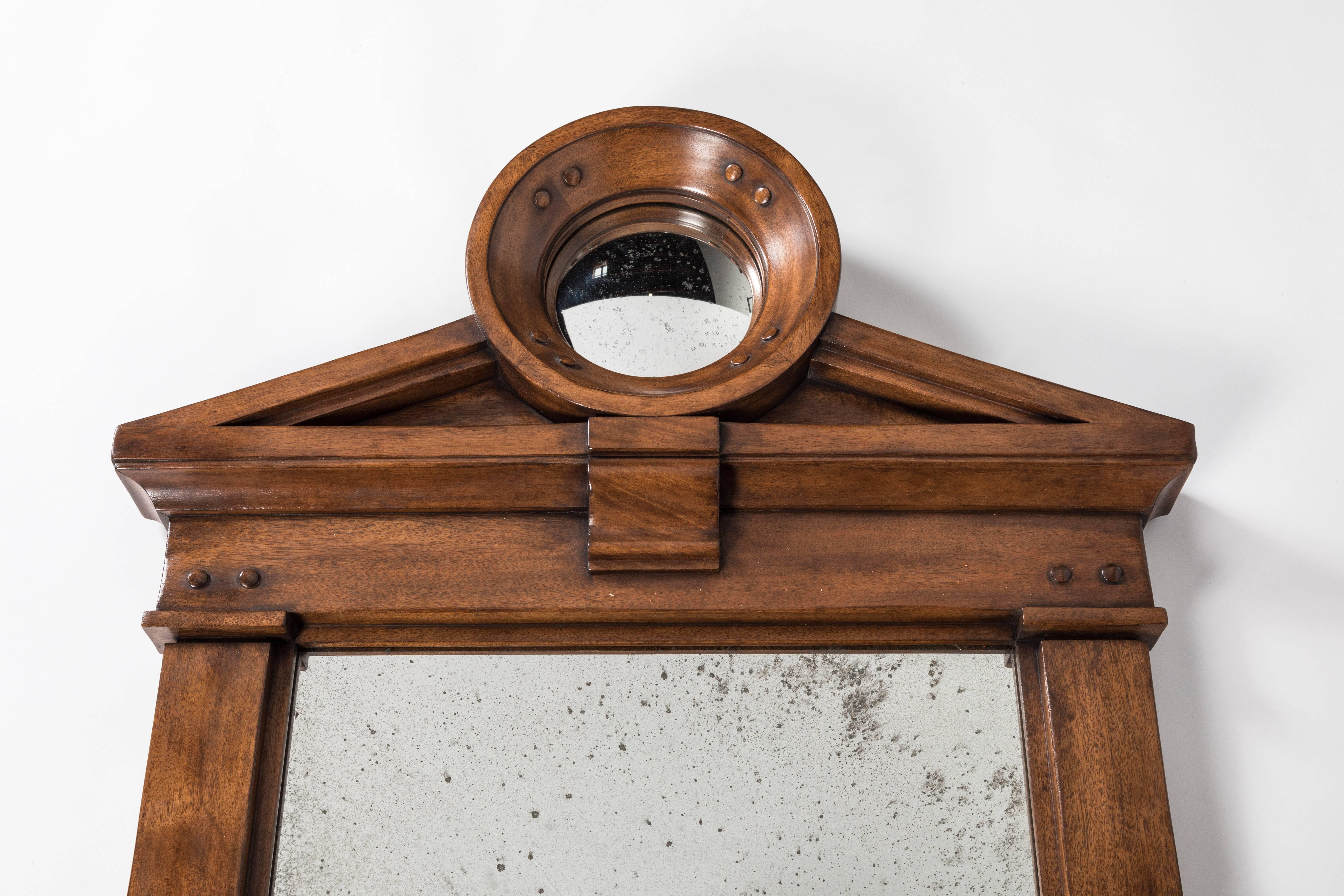 This stately mirror is an idealized “gateway” in the style of Nicholas Hawksmoor, balancing the individualized treatment of parts with the geometry of classical forms. Beautiful in the entry of a traditional or transitional home. 

 


 