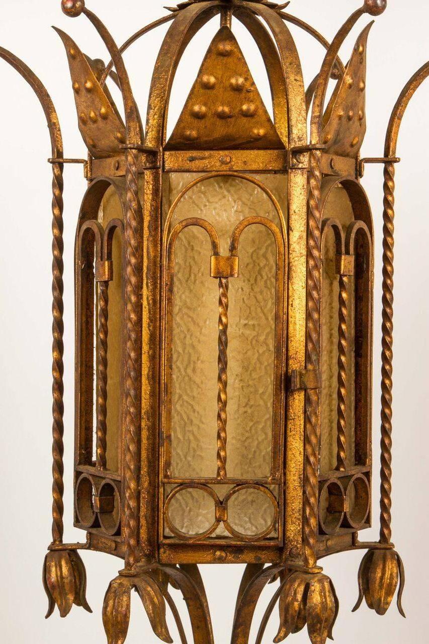This 20th century gilt metal chandelier has absolutely beautiful detailing. 
Six glass panels. 
This lantern would be beautiful in an entry hall.