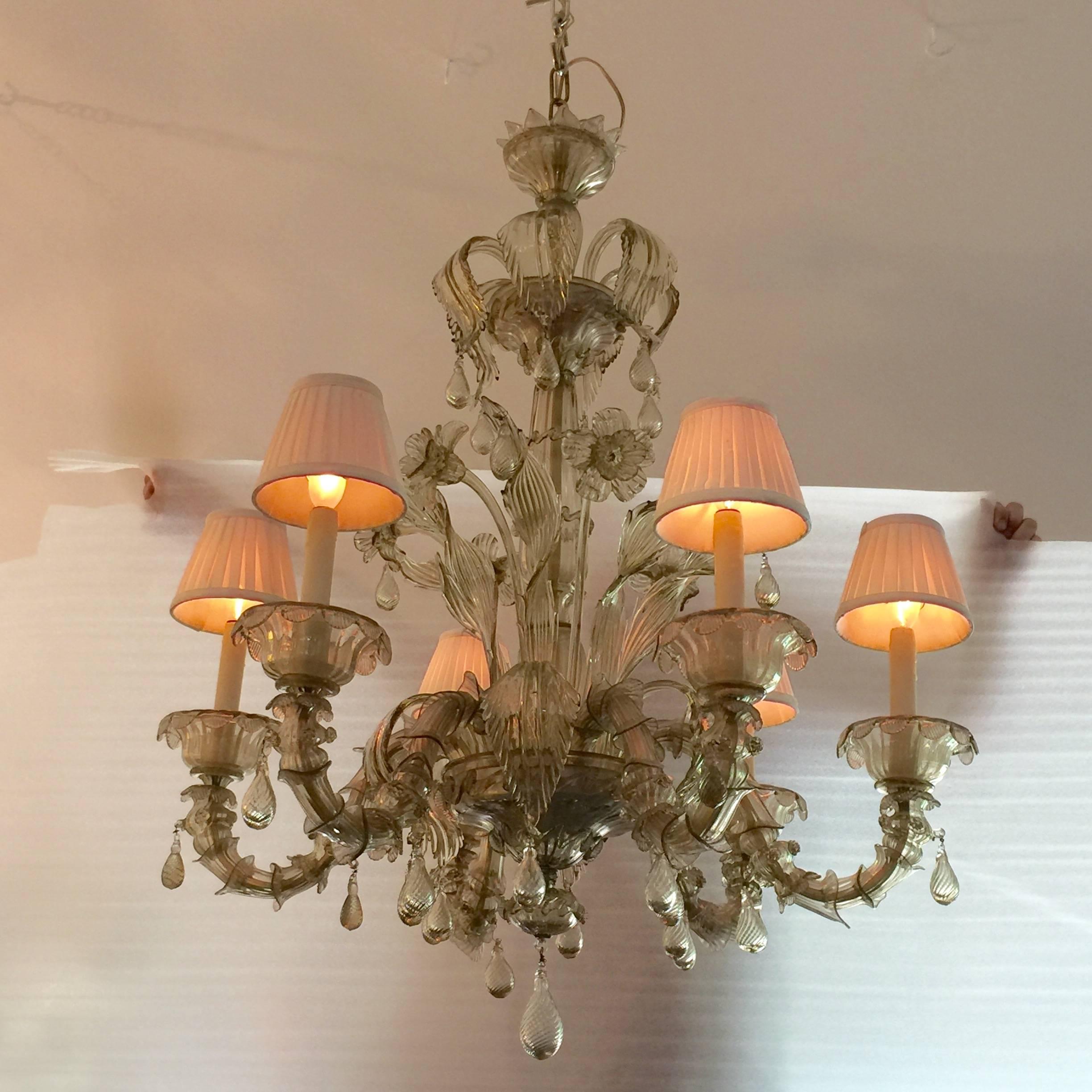 This wonderfully elegant and detailed chandelier by Barovier e Toso, is an exceptional example of handmade Murano fixtures on a grand scale.

This has six arms and shades, many flourished stemmed flowers and leaves with pear drop accents. The