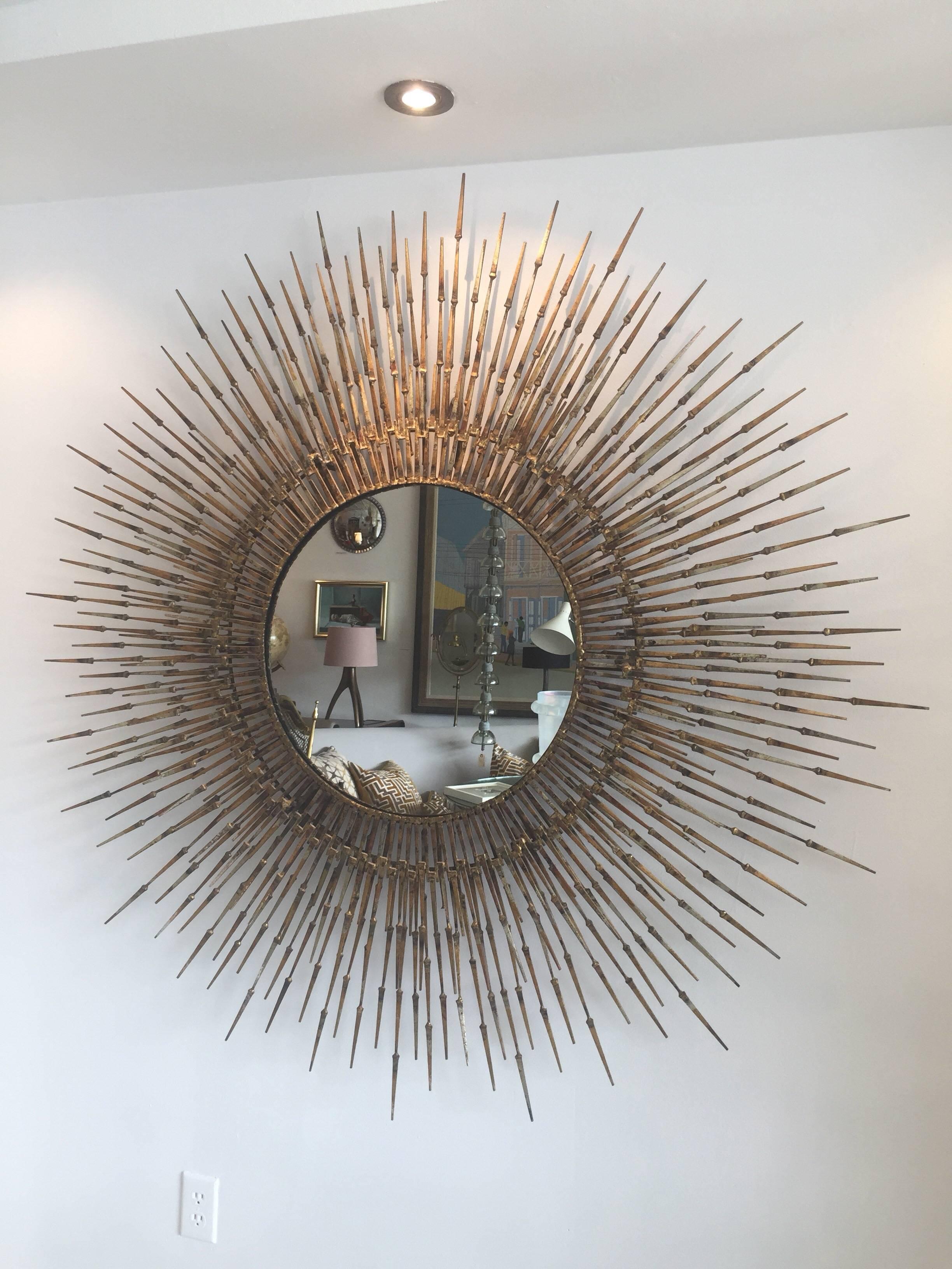 American post-war design gilt metal wall sunburst by William Bowie, circa 1970s.

This is a massive sculptural mirror with hundreds of arms on two levels. Wonderful vintage condition and a stunning statement to any decor.

Measures: 5 feet diameter.