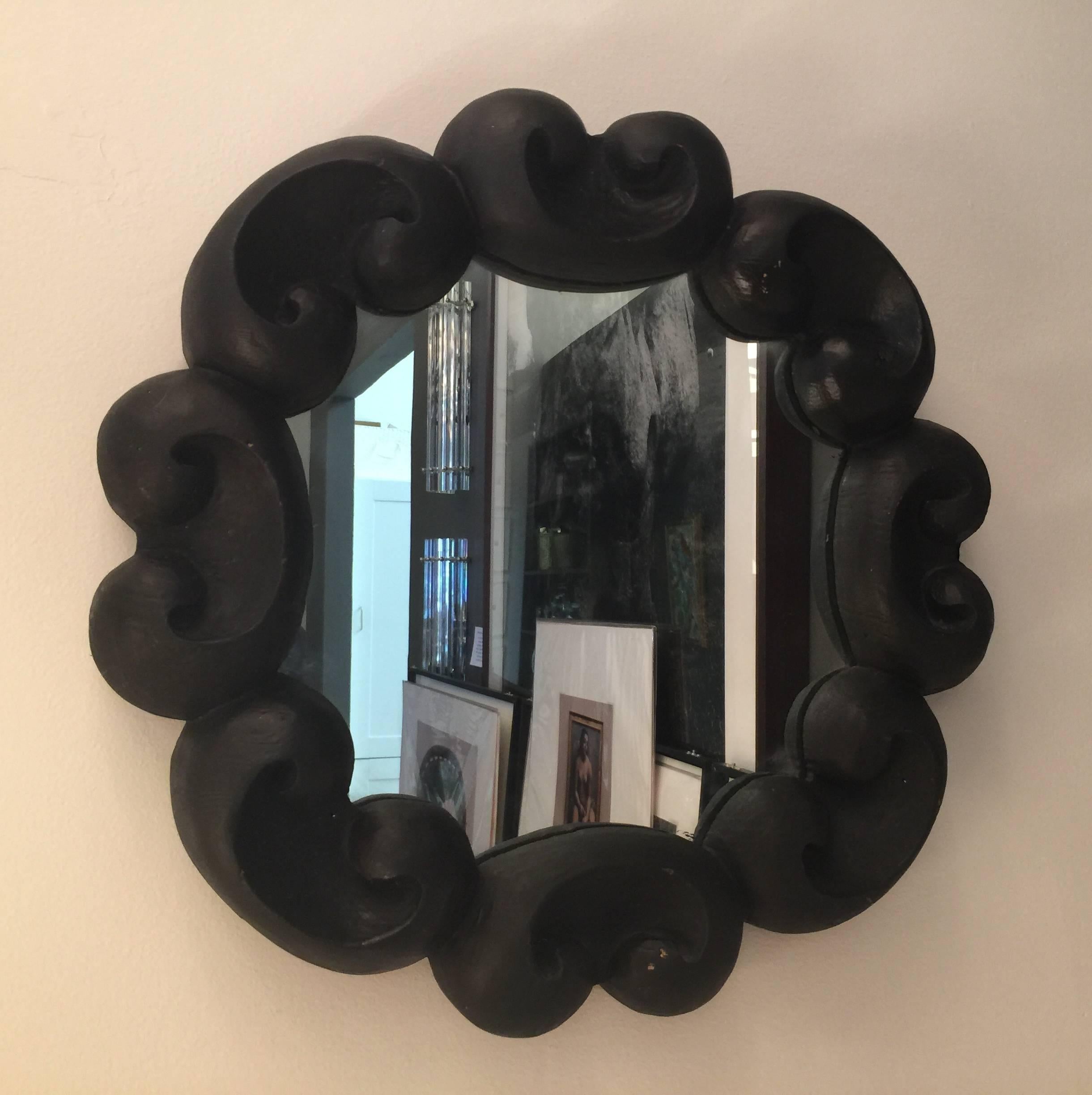 Finely carved and painted black - great accent mirror.