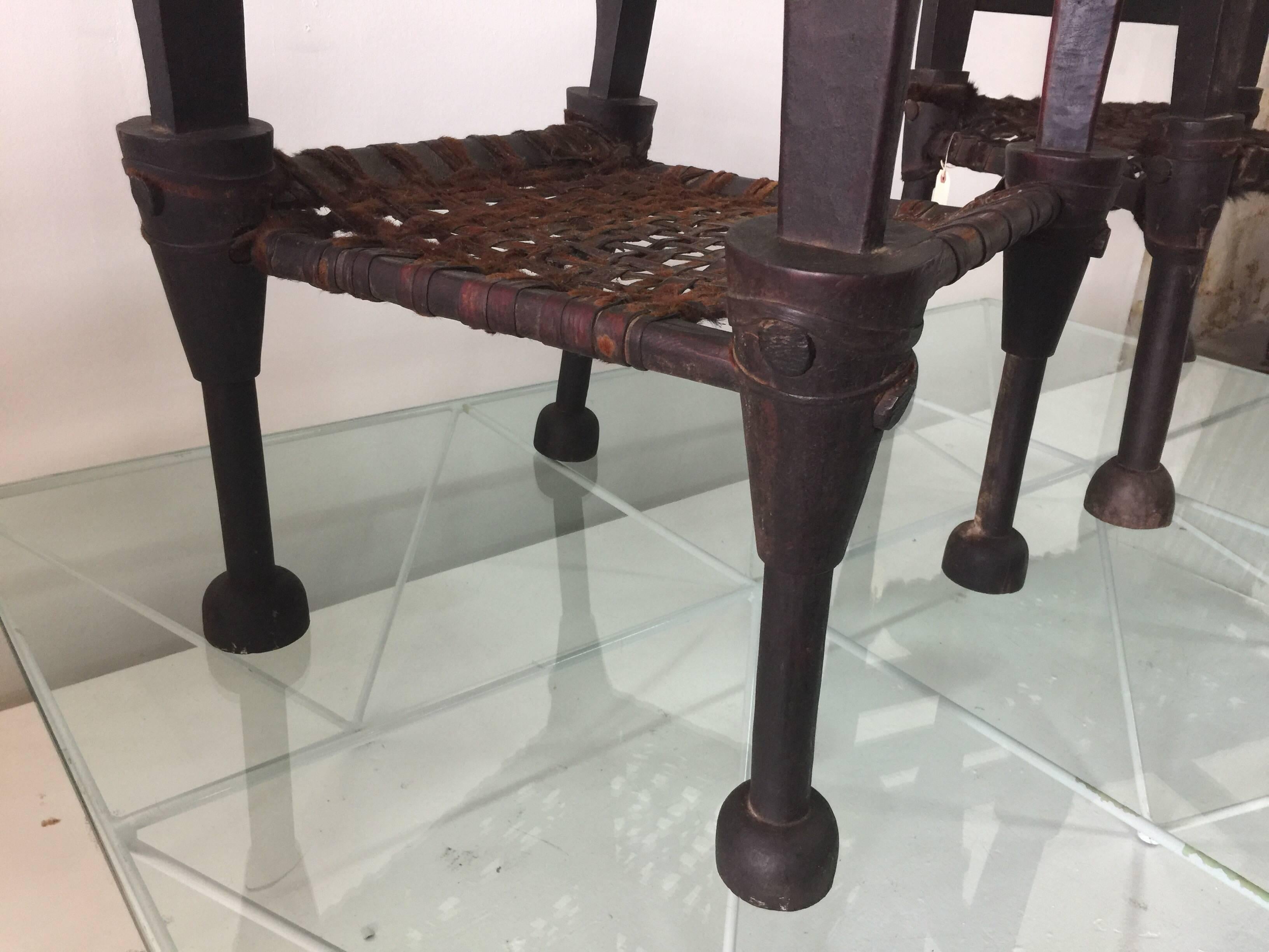 Early 20th Century Pair of West African Ironwood and Leather Throne Chairs For Sale