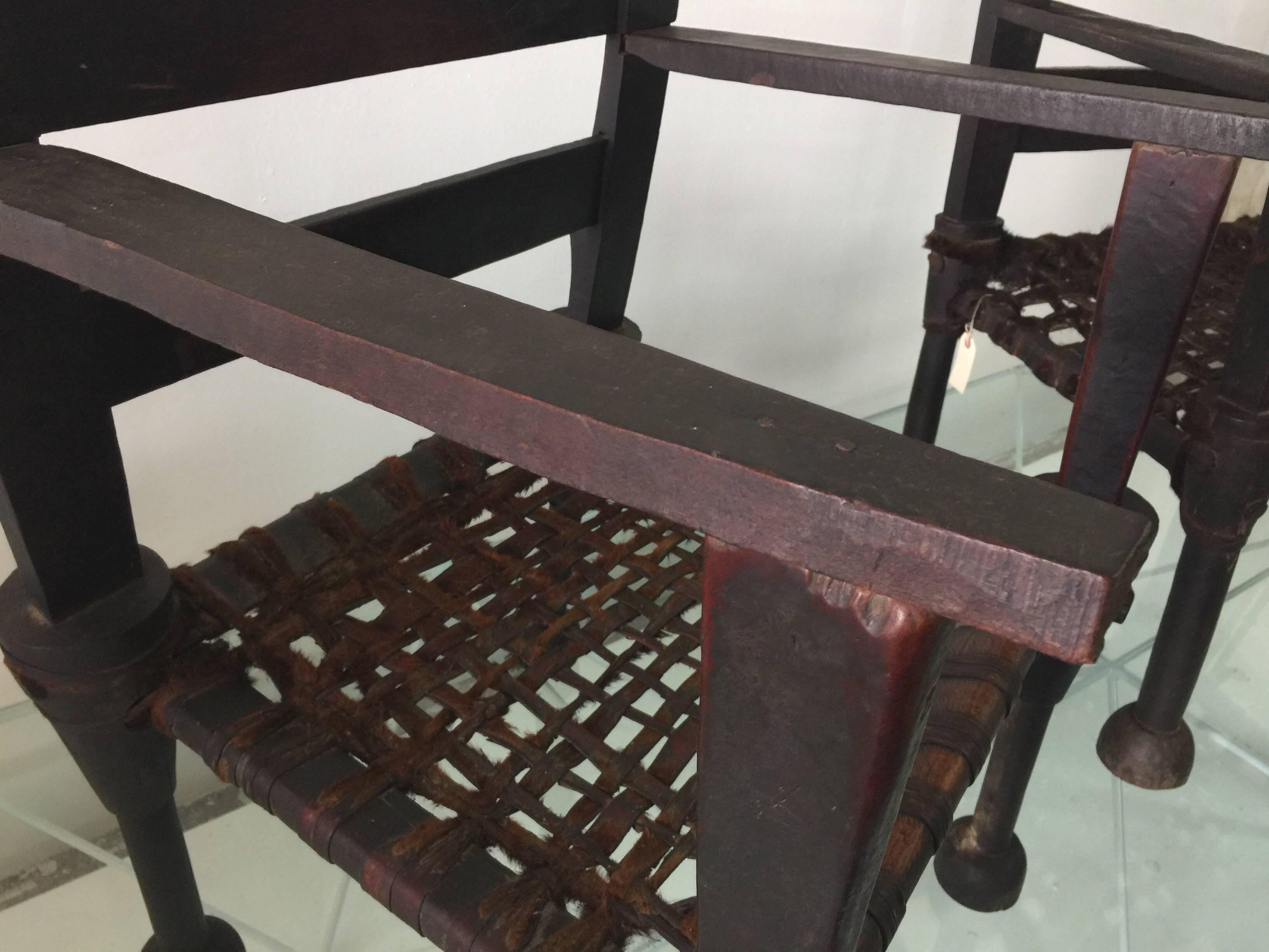Hardwood Pair of West African Ironwood and Leather Throne Chairs For Sale