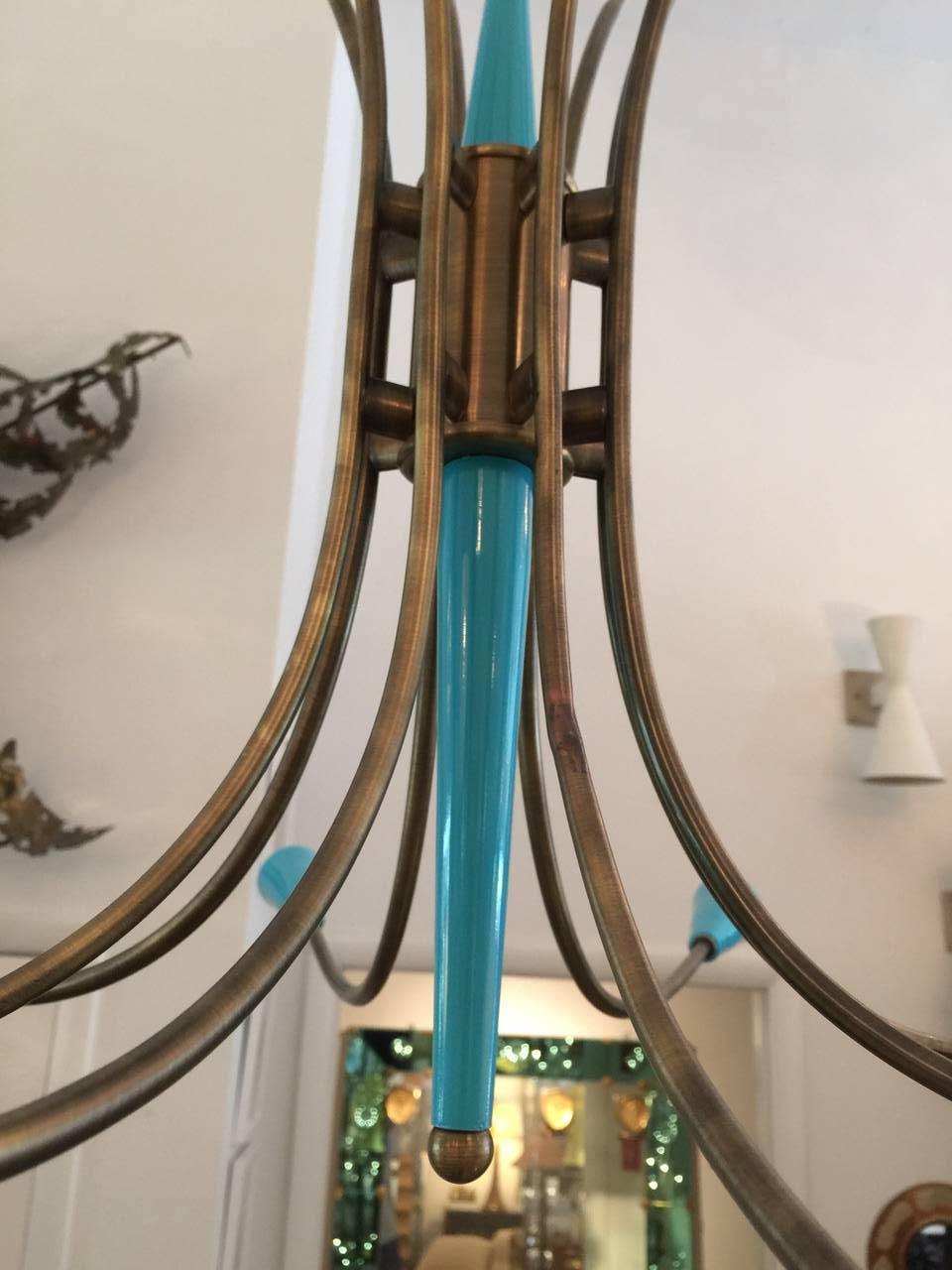 Beautiful Stilnovo style eight-arm turquoise painted metal and dark patinated brass chandelier. Professionally restored.