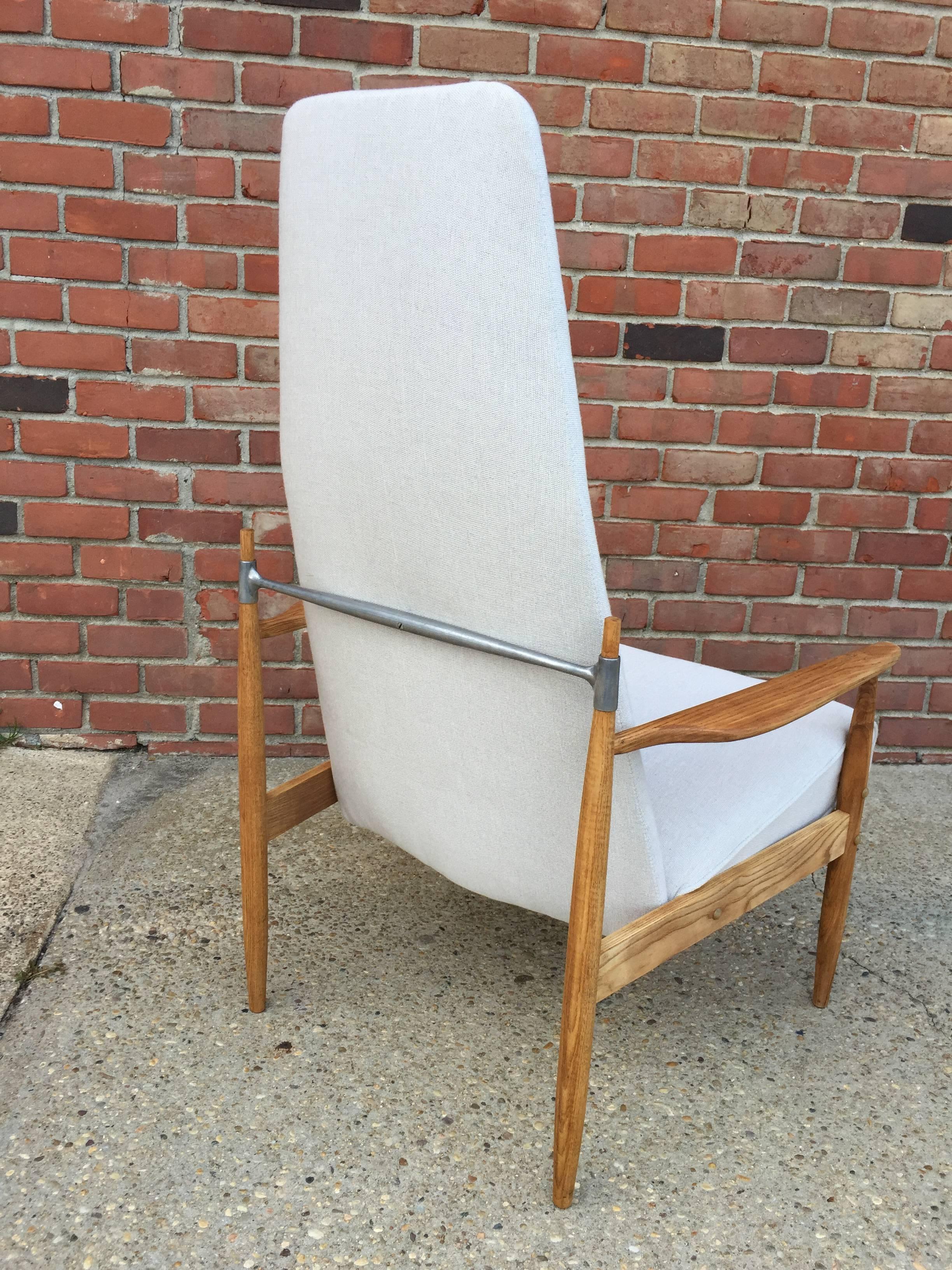 Excellent high back chair in great condition in teak with aluminum accents by Danish Mid-Century designer Peter Hvidt.
