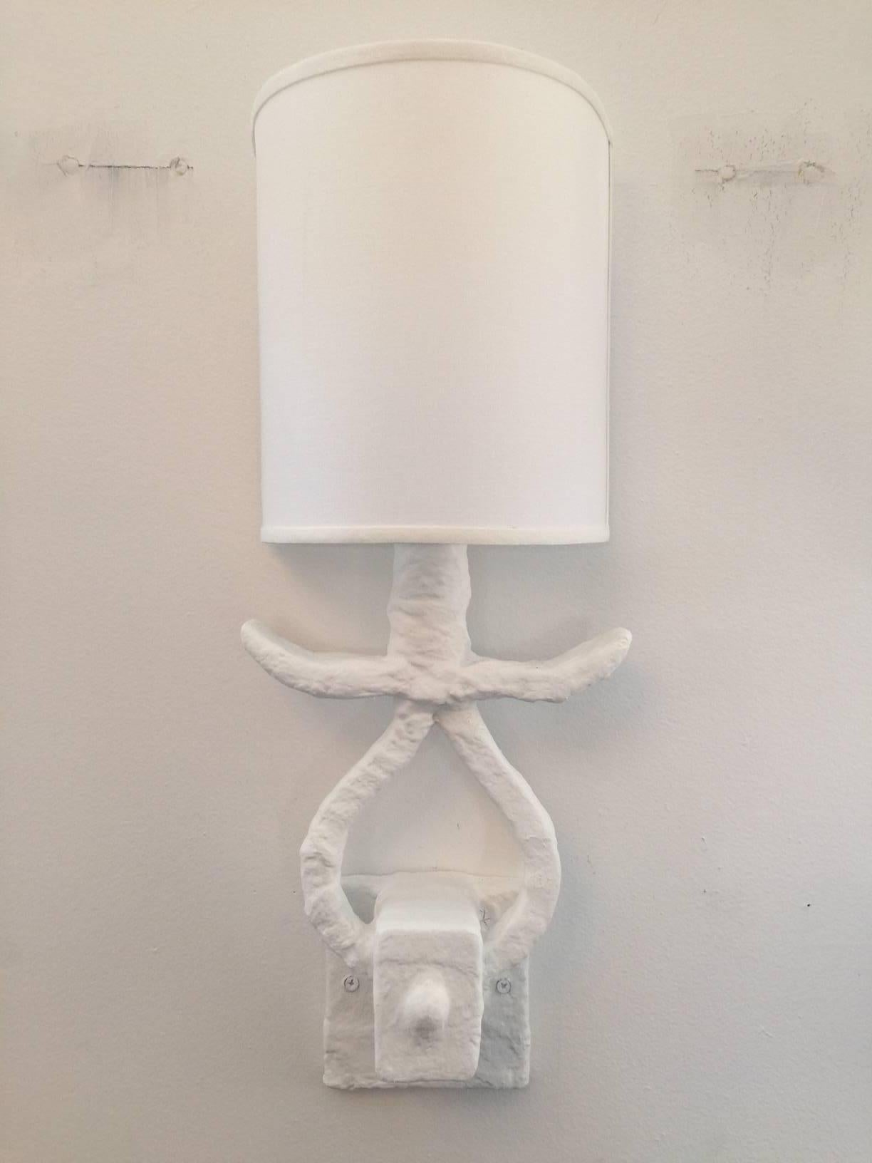 Wonderful plaster wall lights with newly recovered shades, custom for the piece. Sold as pairs only, two available.
