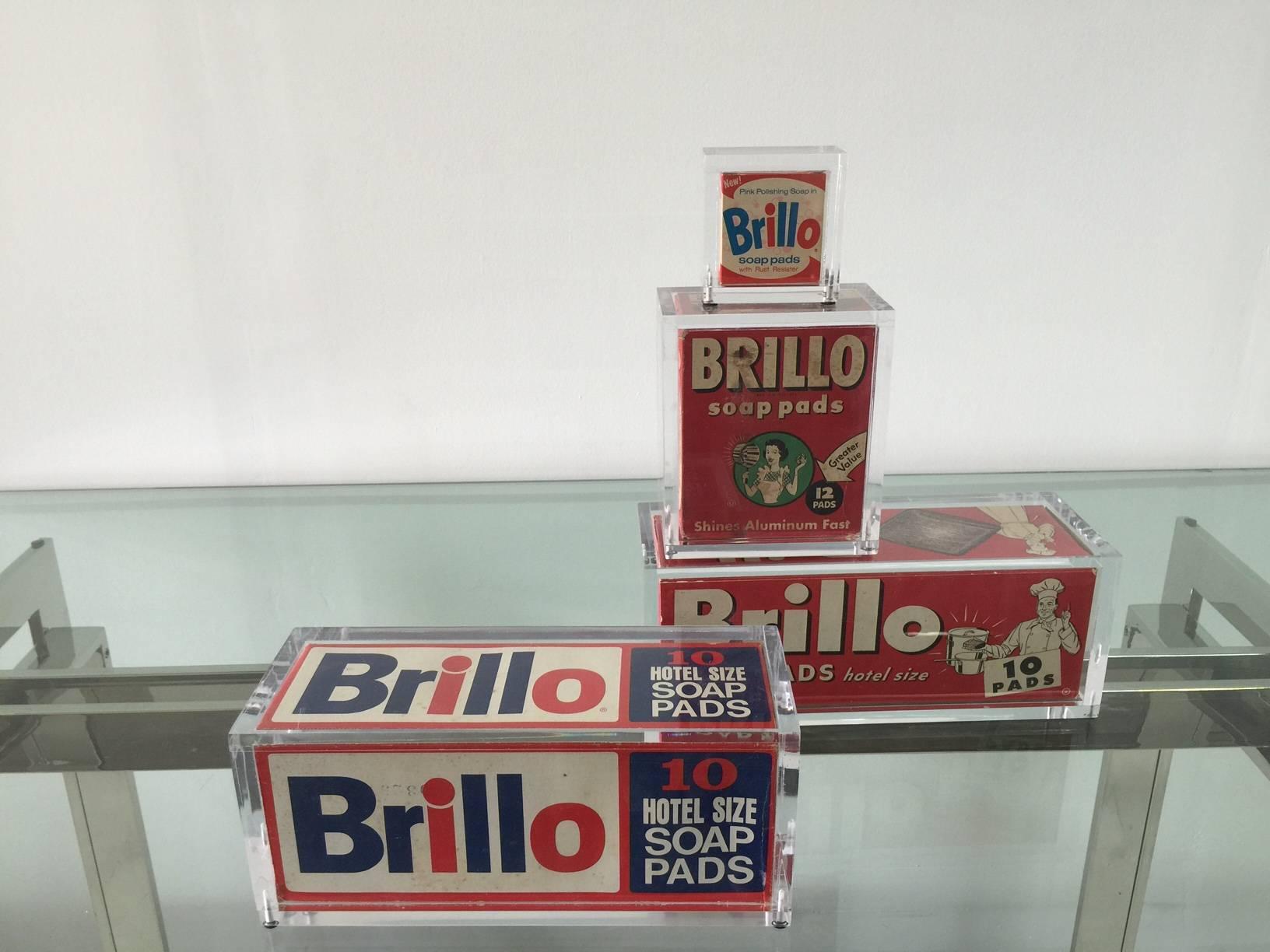 This vintage Brillo box grouping is beautifully displayed in gallery quality acrylic boxes. The collection is inspired by Warhol's fascination for American household items. The boxes are vintage and show signs of age.

Measures: Largest (blue and