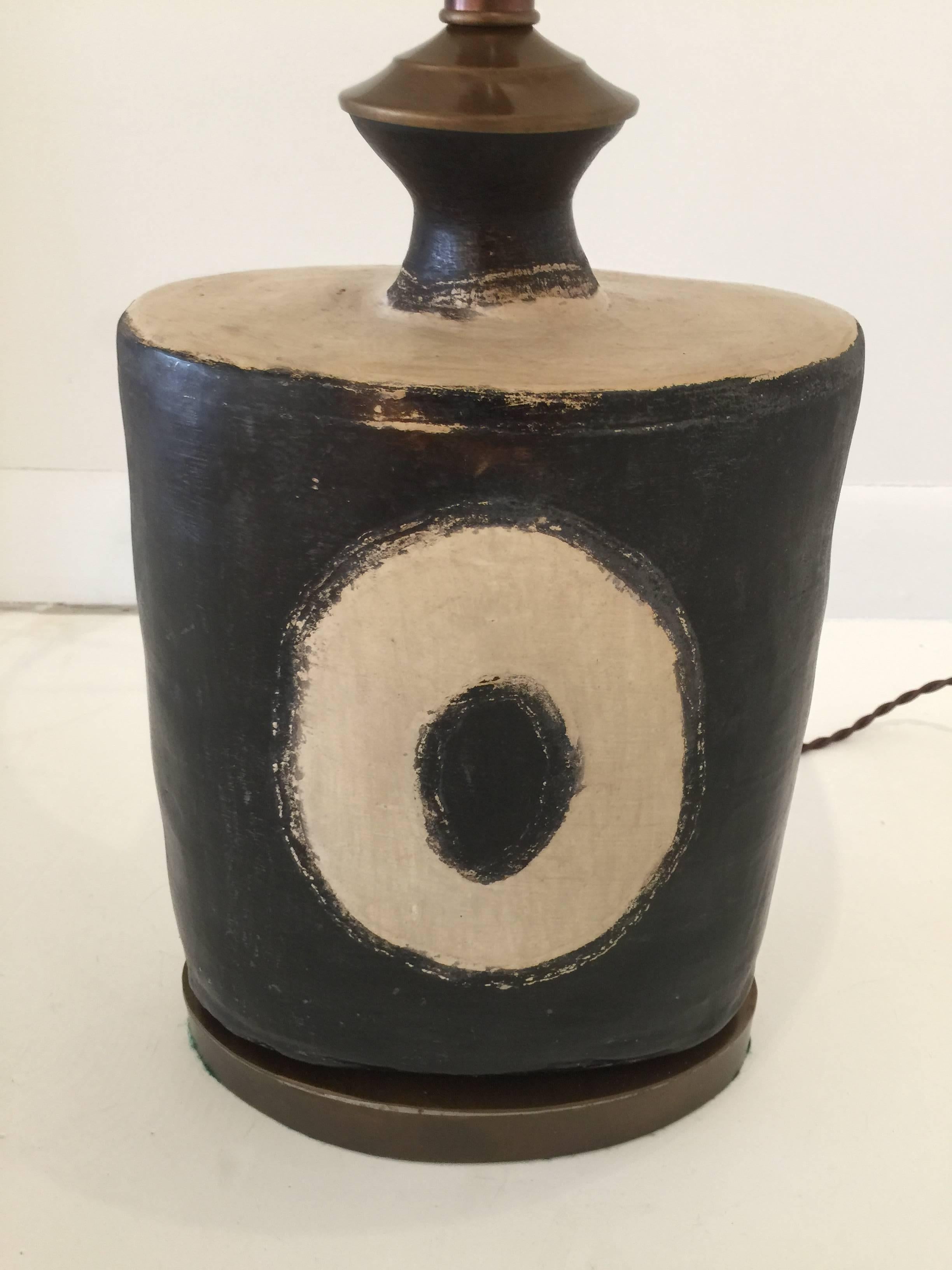 Double sockets and new silk wiring. This lovely dark earthenware with tribal motif is a sleek and modern use of indigenous art.