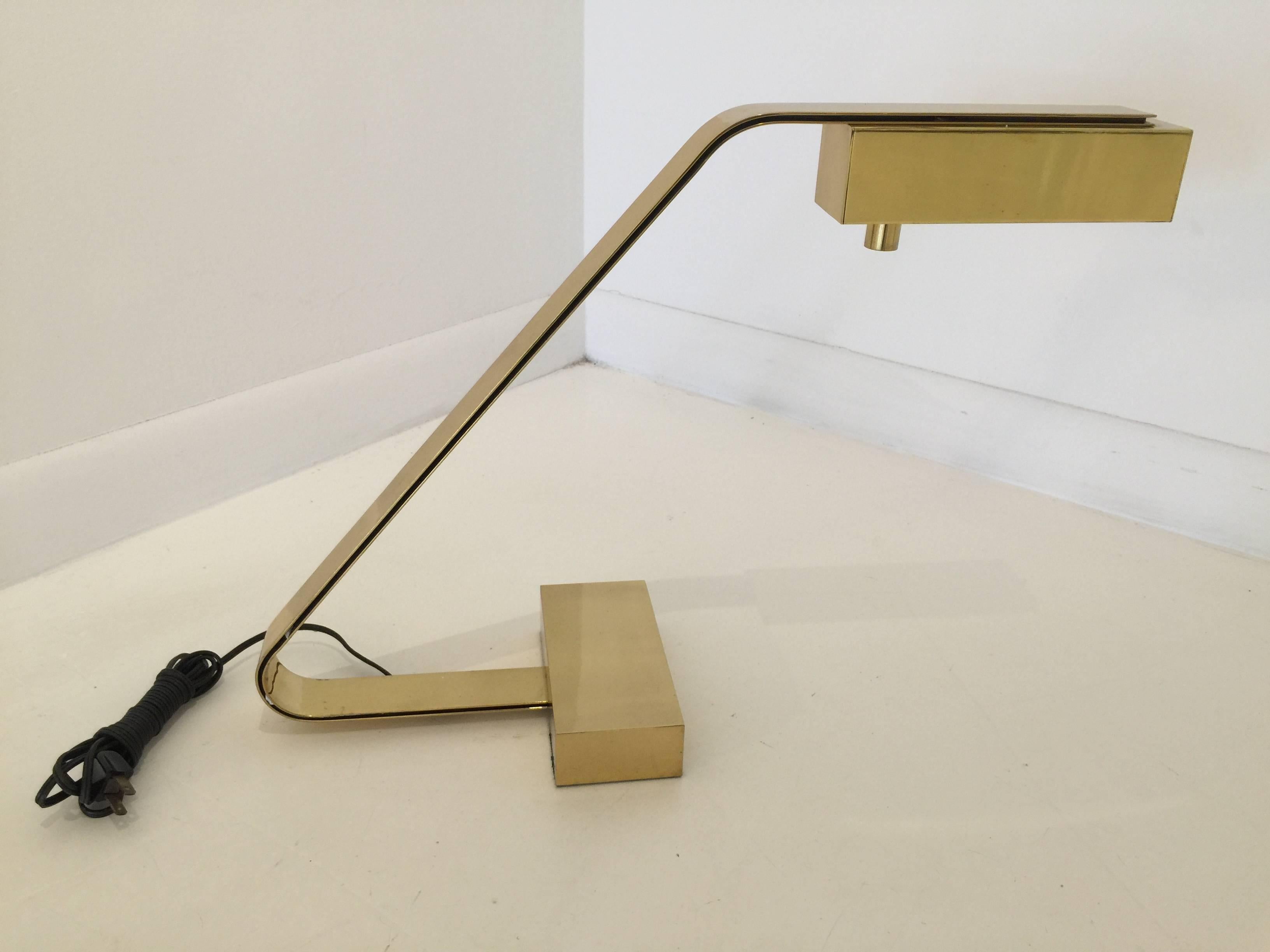 All brass, this cantilevered heavy brass desk lamp by Casella, is a lovely modern touch to any decor.