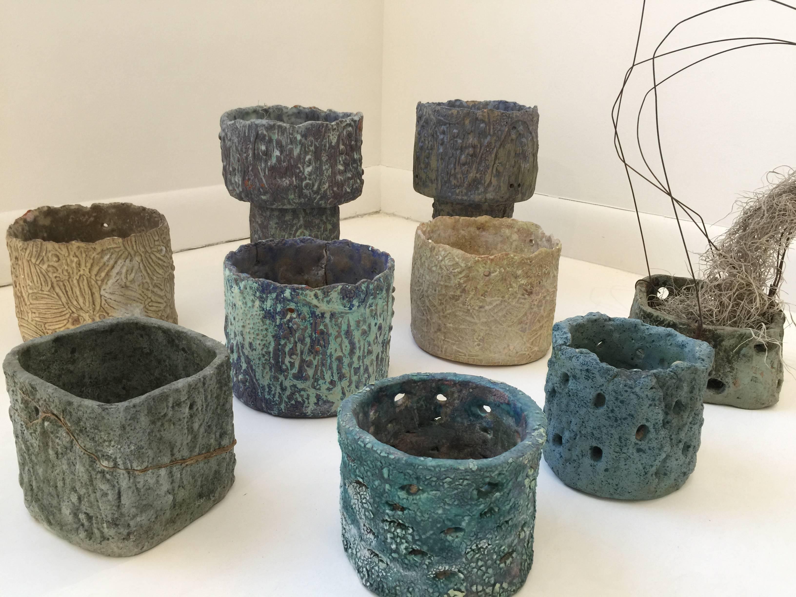 This fantastic collection of original handmade orchid pots in beautiful rough textured ceramic by noted Miami artist, Juanita May (1920-2013), circa 1960's.

A self-taught artist, May was a member and teacher at the Ceramic League of Miami. A 1963