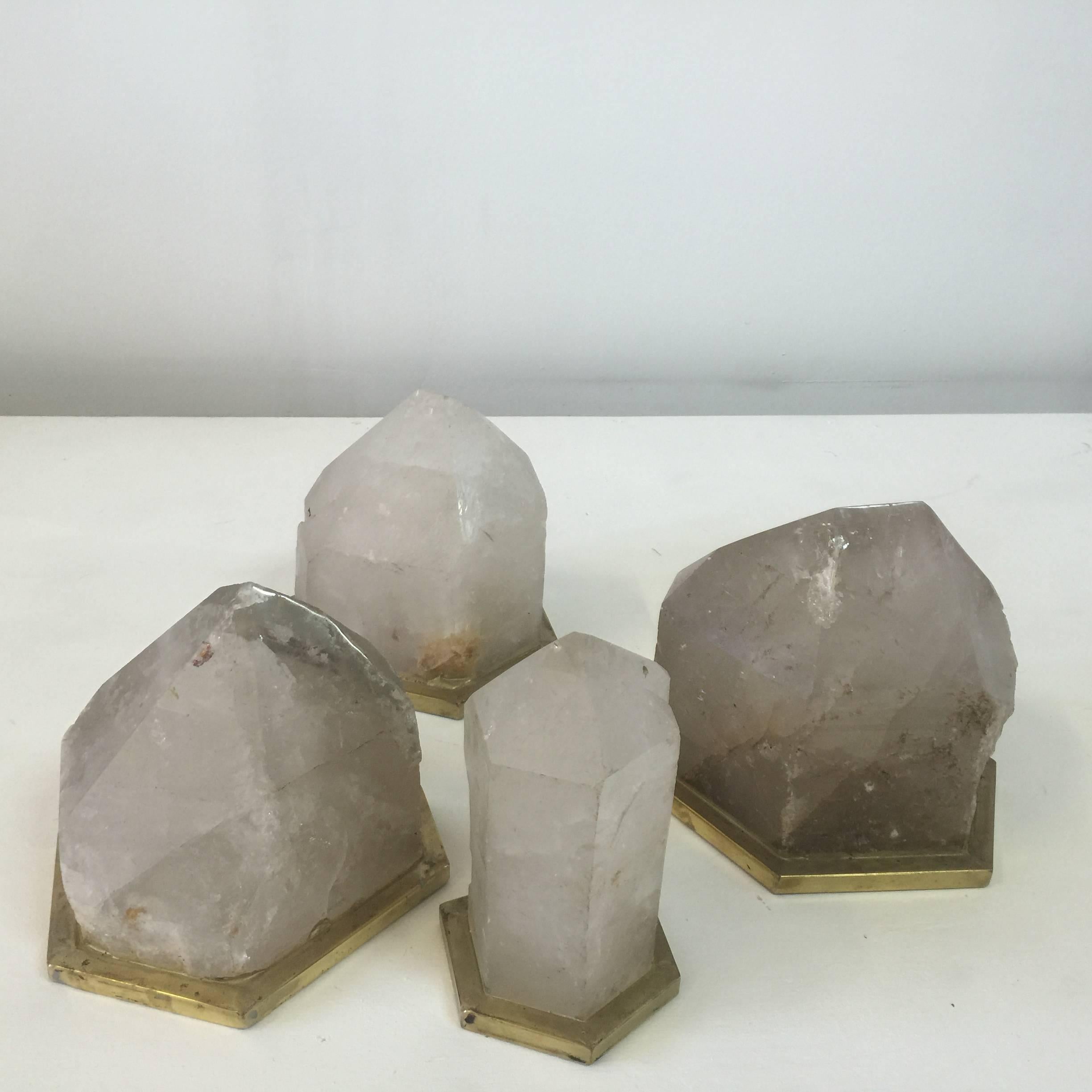 These very large gem cut quartz pieces with natural/clear tones are set in custom brass bases. There is a hollowed out space to underside of stones to accommodate a small bulb if you wish to convert them to ambient lights.

Dimensions:
Large: 12