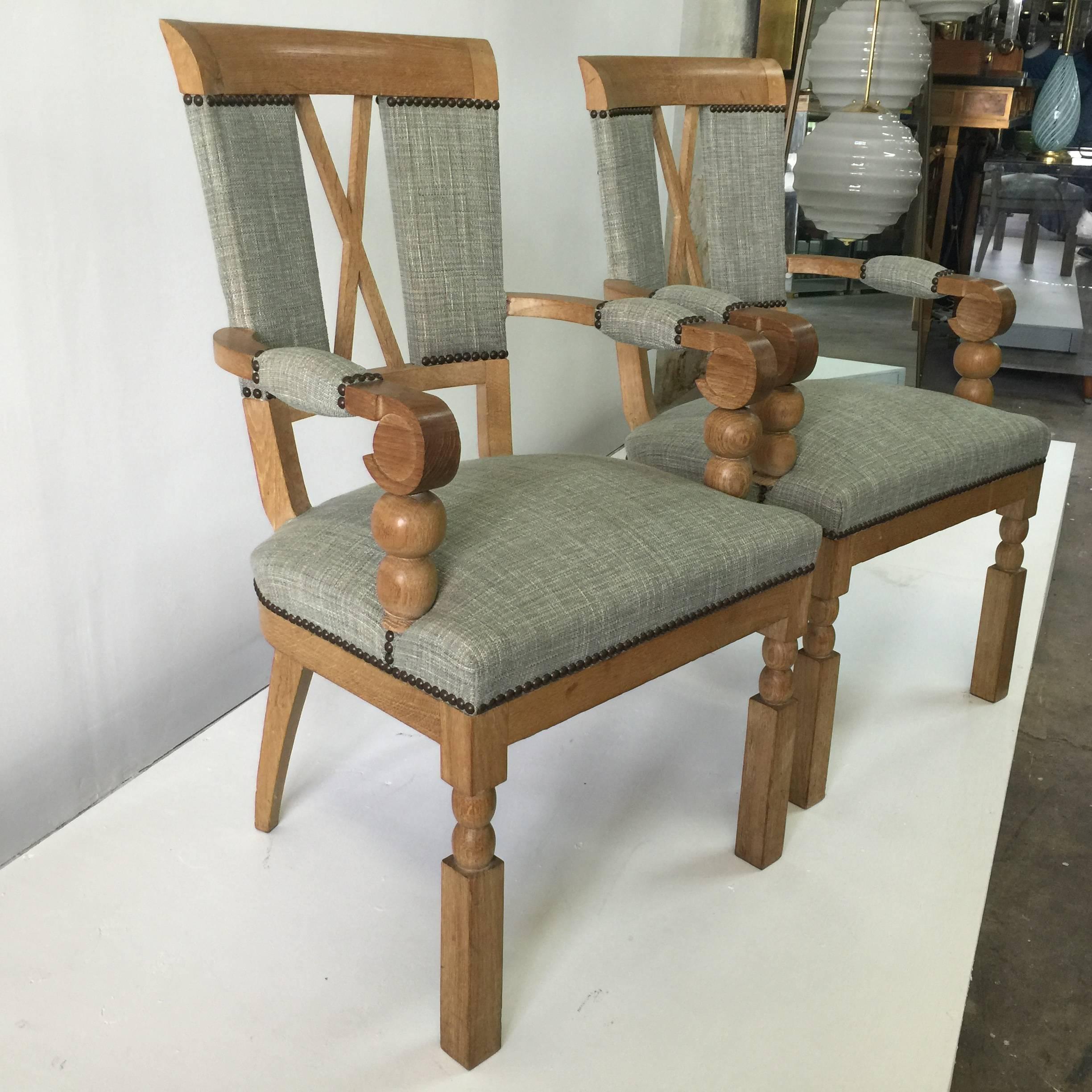 Fine turned oak balls, criss-cross backrest and carved wood accents a plenty on these stunning armchairs. Upholstered in a mint Chanel style wool weave fabric. (attr. André Arbus).
