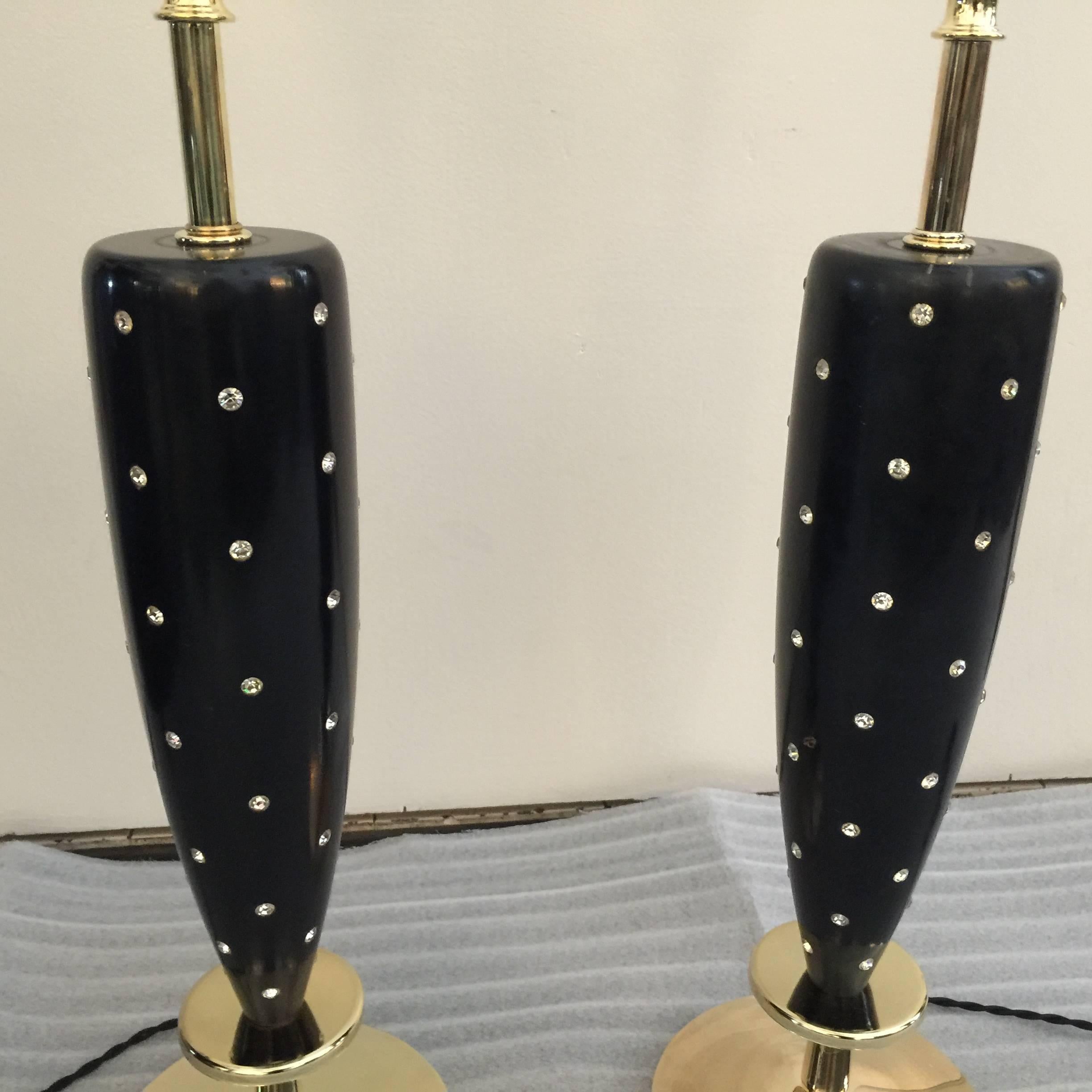 These wonderful Mid-Century table lamps by Rembrandt have been rewired and polished. The black lacquered wood is original with minor scuffs. A chic and glamorous design touch with embedded rhinestones. Milk glass diffusers are original as well in