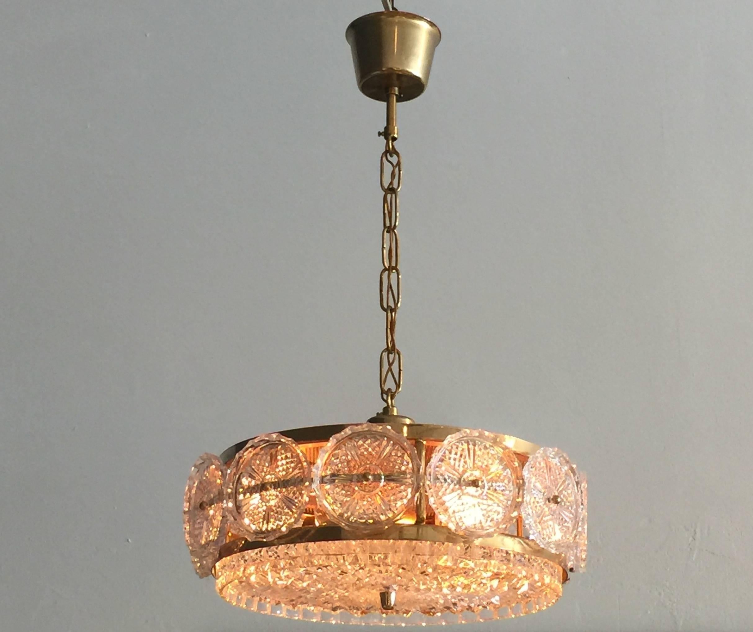 Sweden's Orrefors glass is world reknowned, this art glass chandelier is in wonderful original vintage condition.