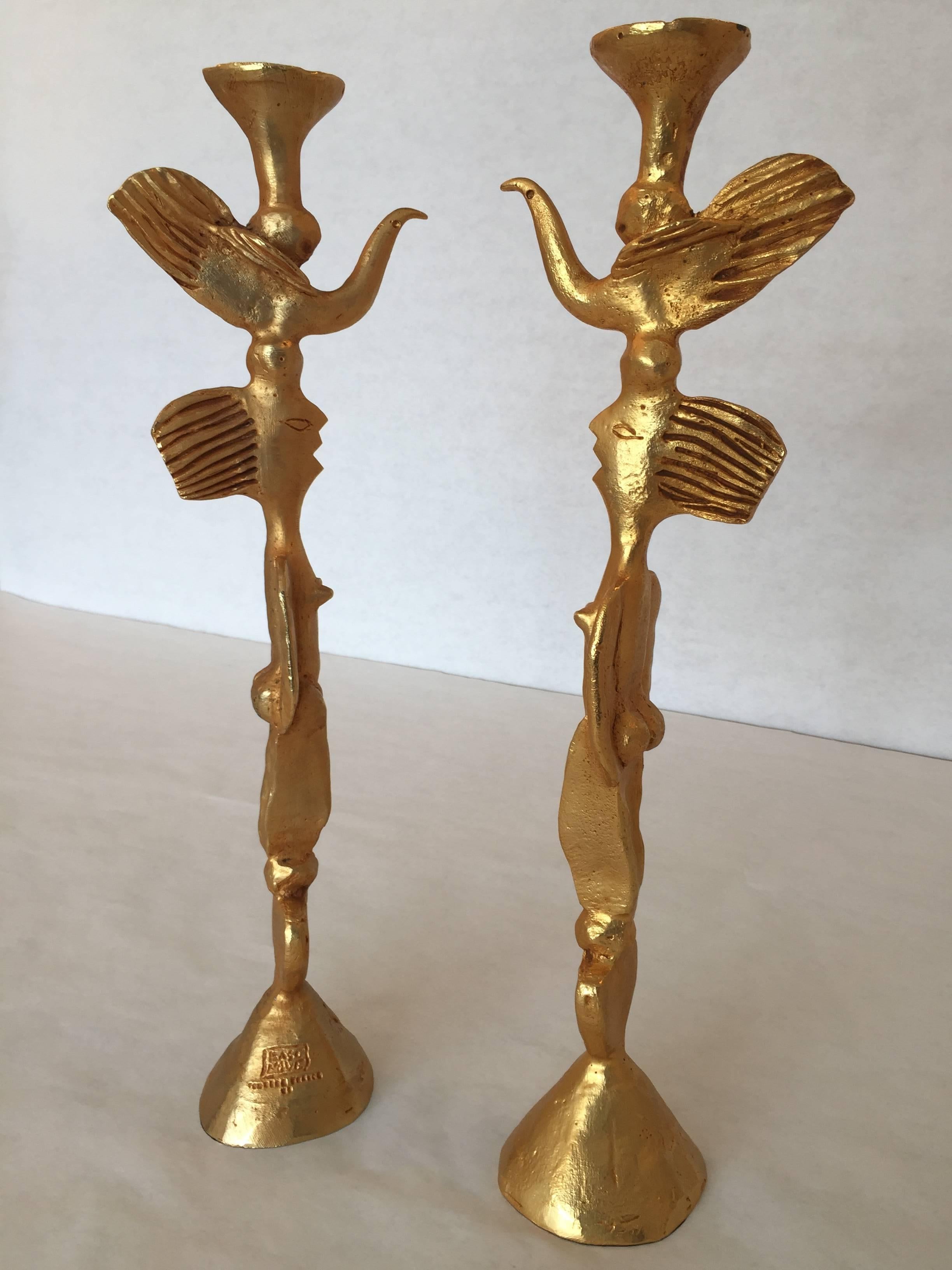 Pair of whimsical bronze candlesticks by Pierre Casenove featuring birds and figural bodies. These are very heavy and quality made.