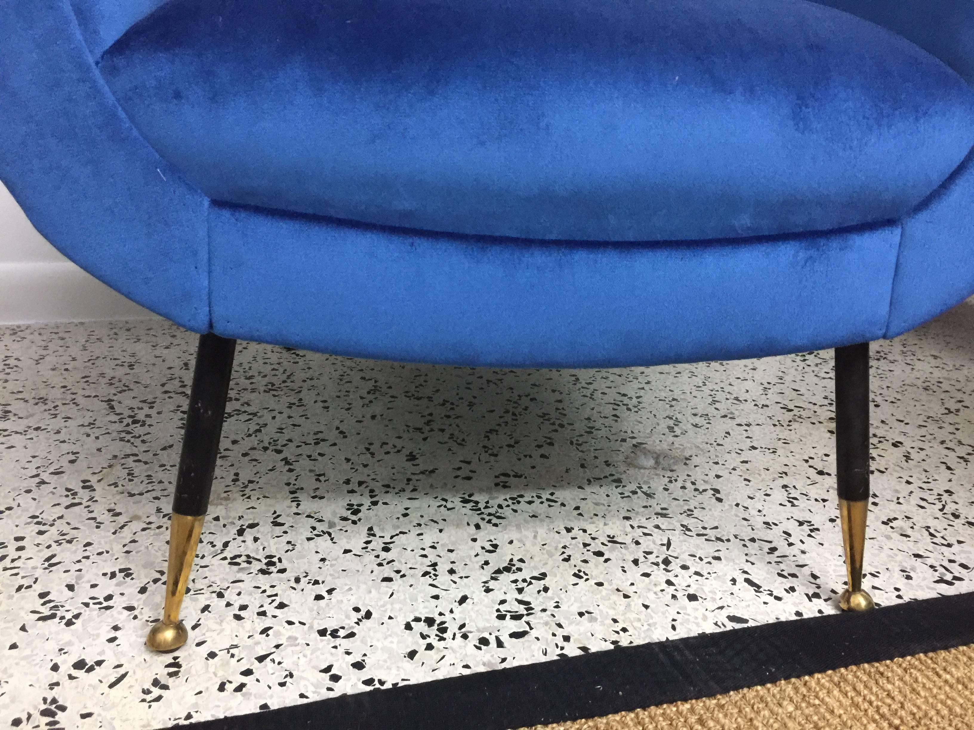 Well proportioned armchairs with ample seating and backrests. Finished in rich Italian mohair velvet - rich blue. Original feet with brass tips.