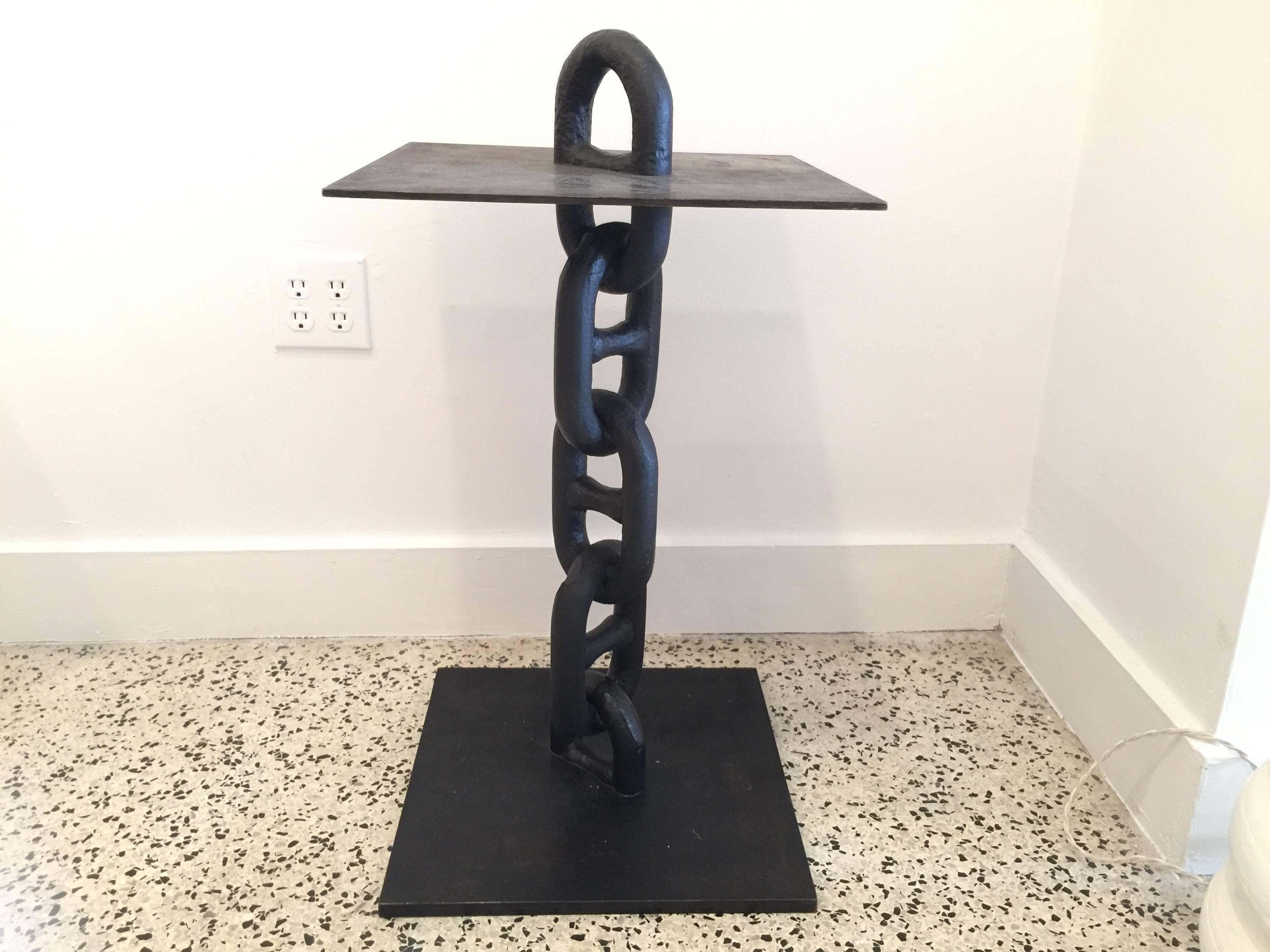 In the brutal style after Hermes' iconic chain design, this studio piece is by Gustavo Olivieri.

Only four tables made - priced and sold individually.

Note: total height to top of chain is 30.5 inches.