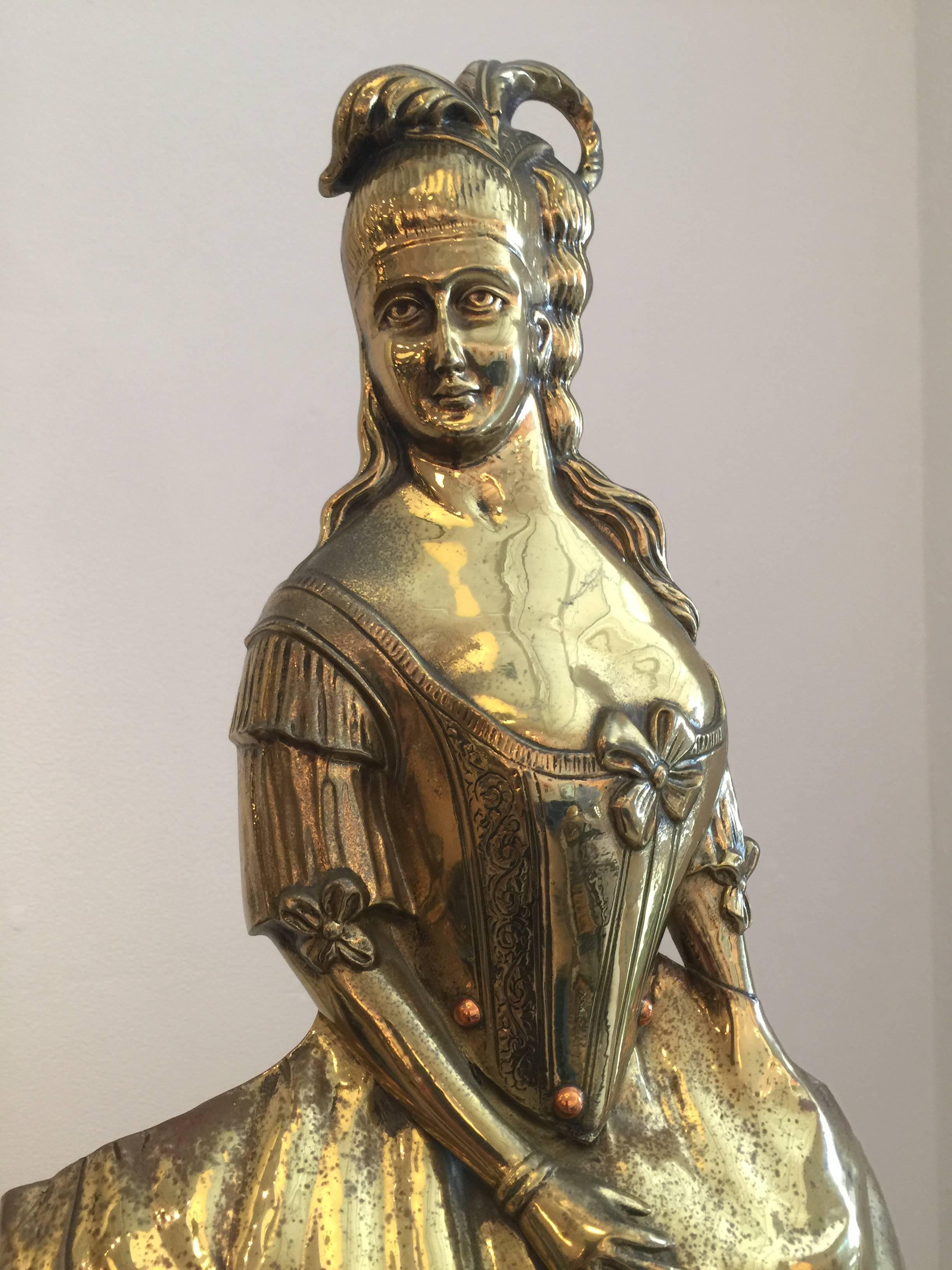 Extremely beautiful brass figure of Queen Marie Antoinette, this is great for a sculpture or standing accent in your decor. It is a firescreen and is embellished with copper beads and exquisite detail on the face and hands.