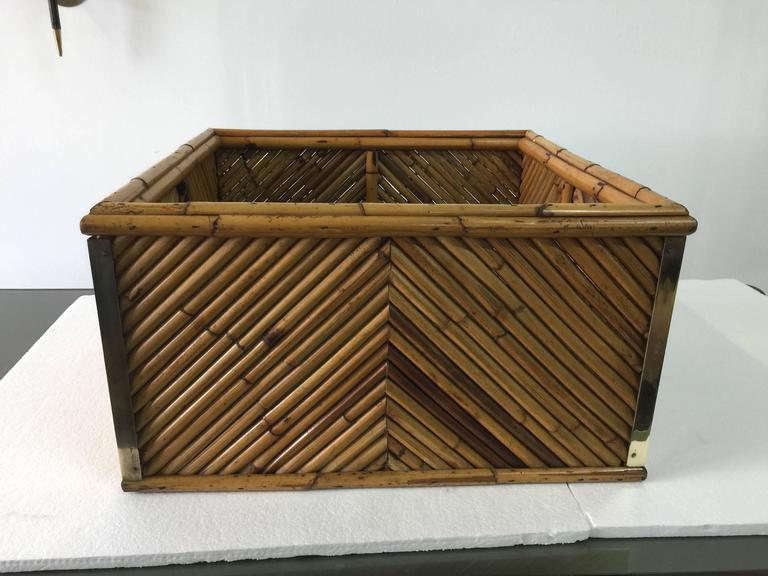 This oversized cut bamboo and brass trim square planter with original galvanized metal liner. This is an original vintage Gabriella Crespi piece from her Rising Sun series. Geometric design cut bamboo.