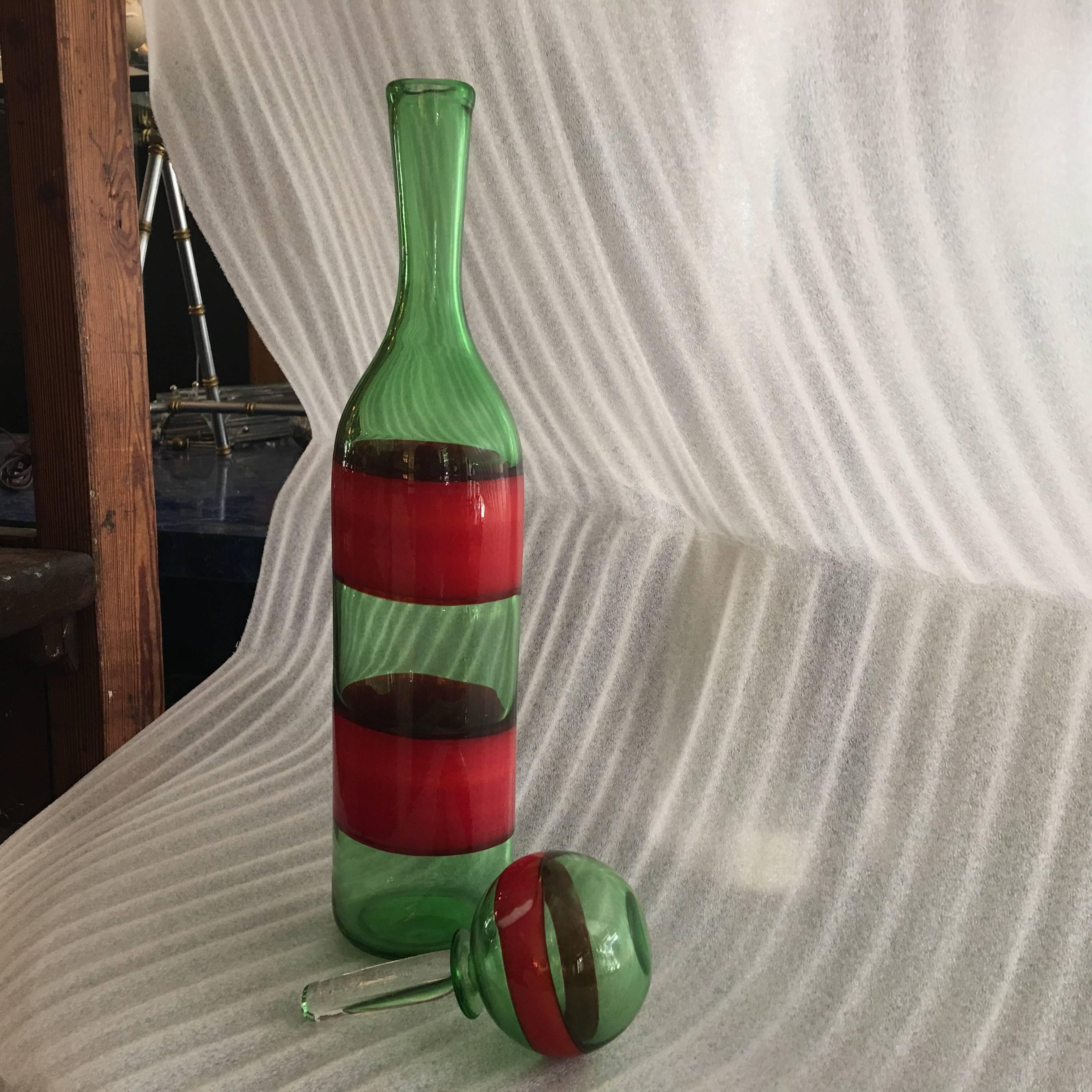 Rare hand blown Murano glass decanter with stopper by Fulvio Bianconi for Venini Co. Murano. Rich green and red stripes. 
Signed with Acid stamp: Venini Murano Italia.