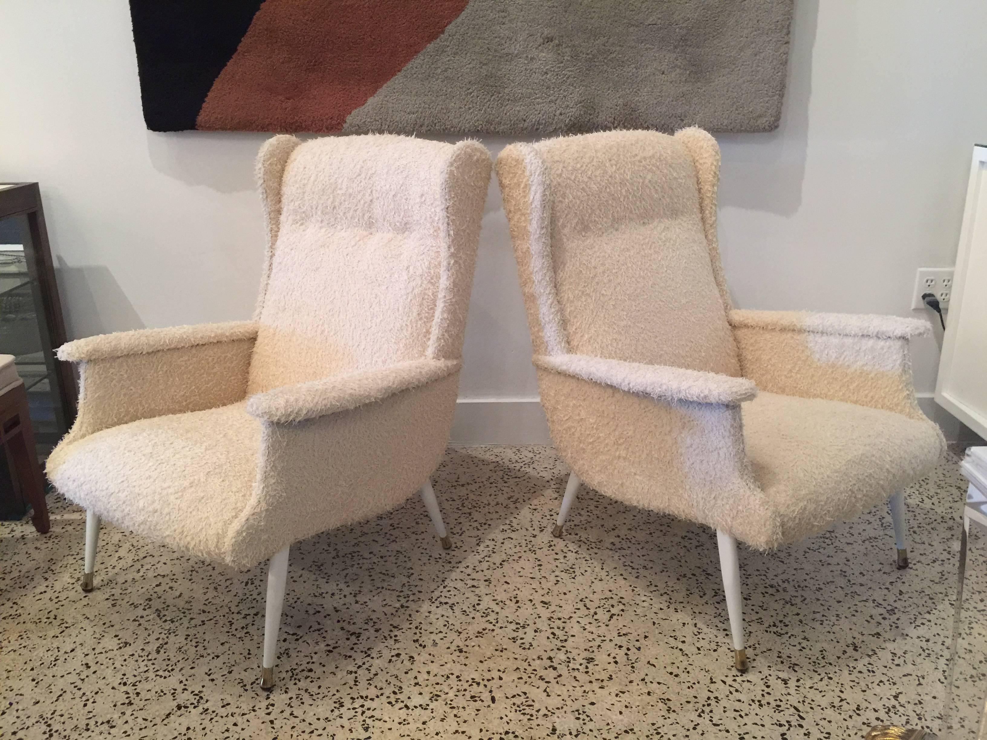 Bone colored low shag fabric add some whimsy to these restored vintage armchairs.