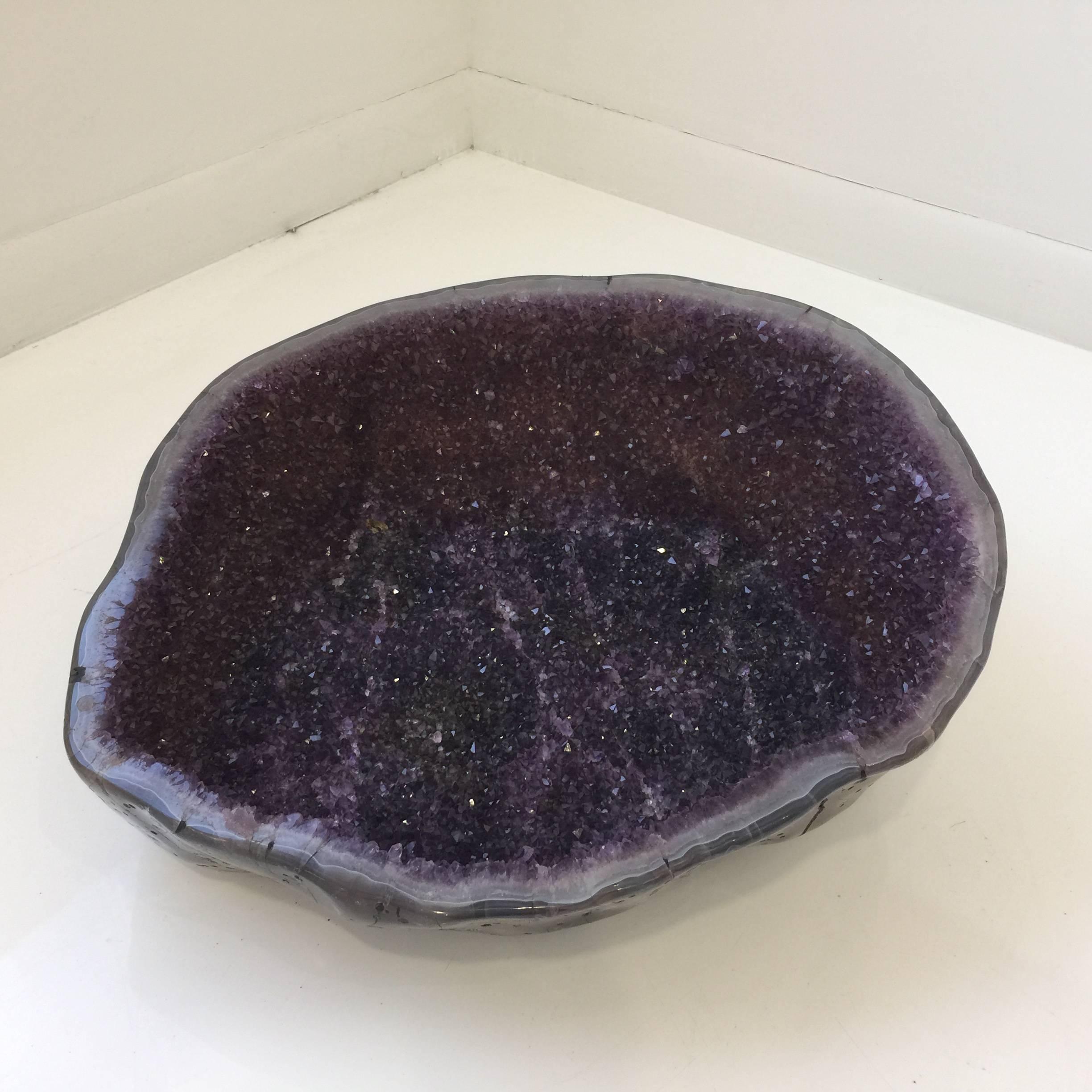 Deep purple crystallized Amethyst bowl, polished exterior of bowl with resin coat that protects the geode.