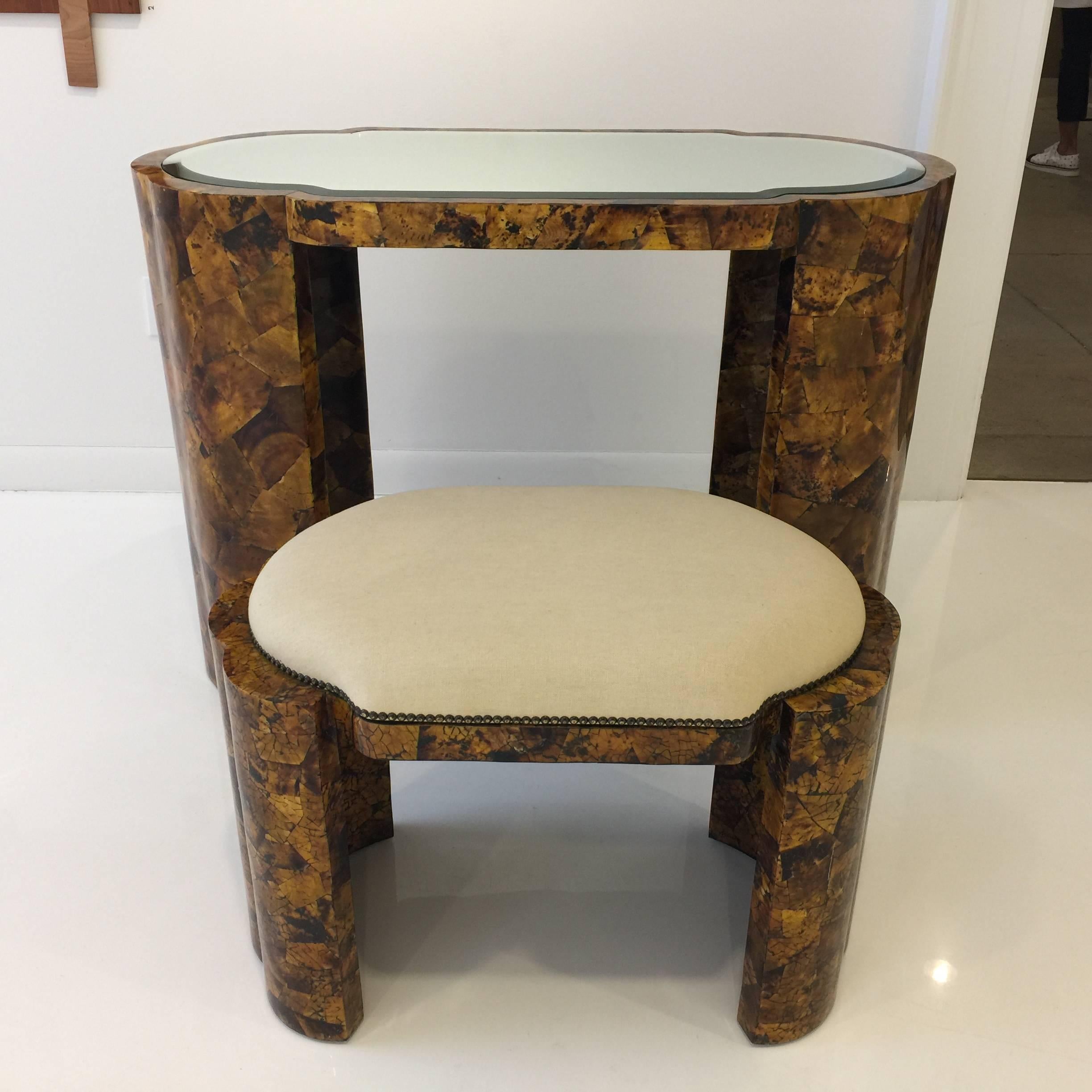 Rich and beautiful Art Deco inspired tortoise finish vanity and stool with bevel mirror top.

Bench dimensions: 28.5 wide, 16 inches deep, 20 inches seat height.