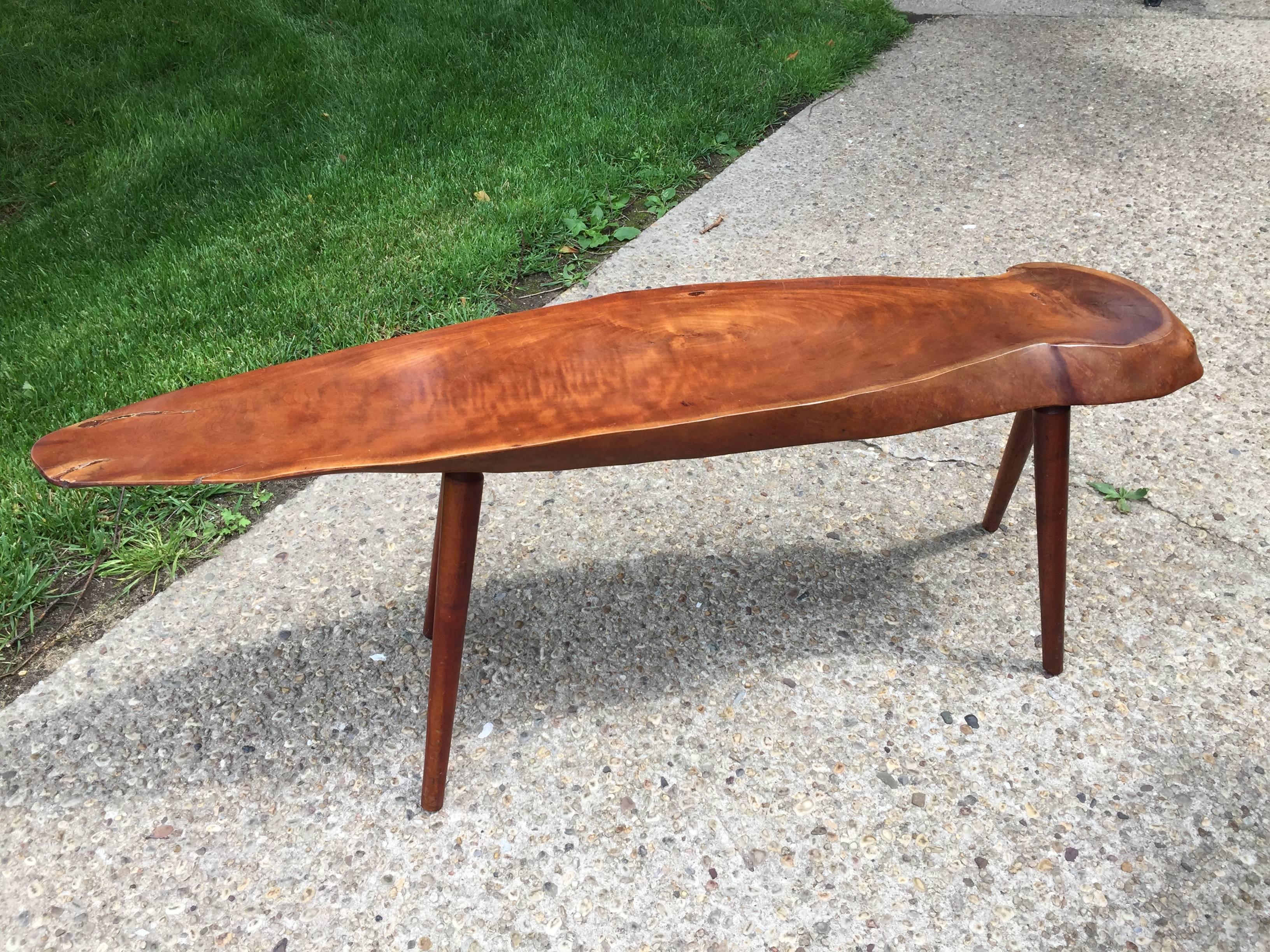 Natural black cherry and signed to underside, this natural wood specimen is very clean and sturdy. Original legs and well crafted. In the family of George Nakashima's finely crafted natural wood creations.