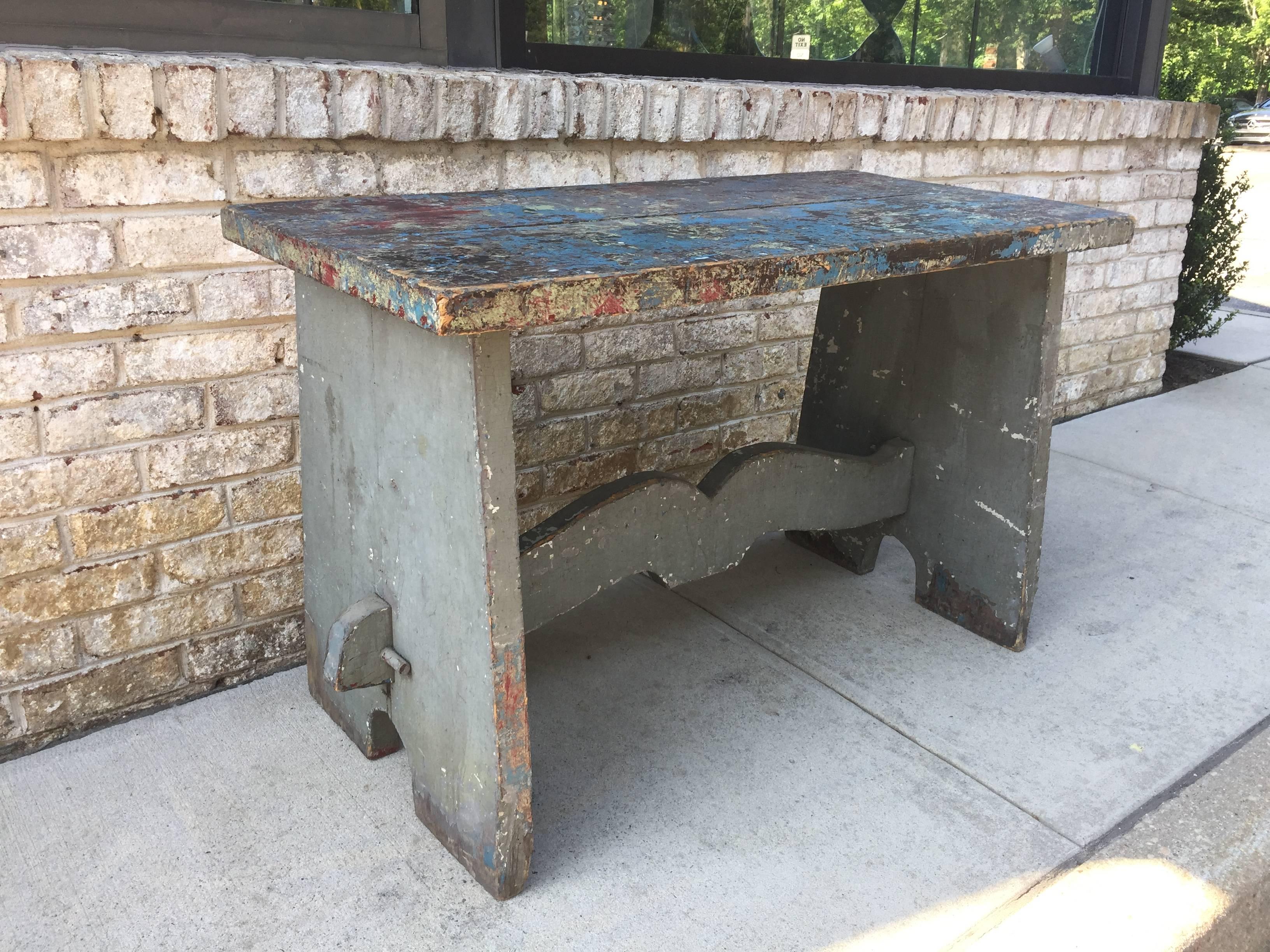 Beautifully distressed and patinated in hues of greys, blues and reds; after years of art making and artistic work this magnificent antique Dutch working art studio table or console will make that special place in your decor.