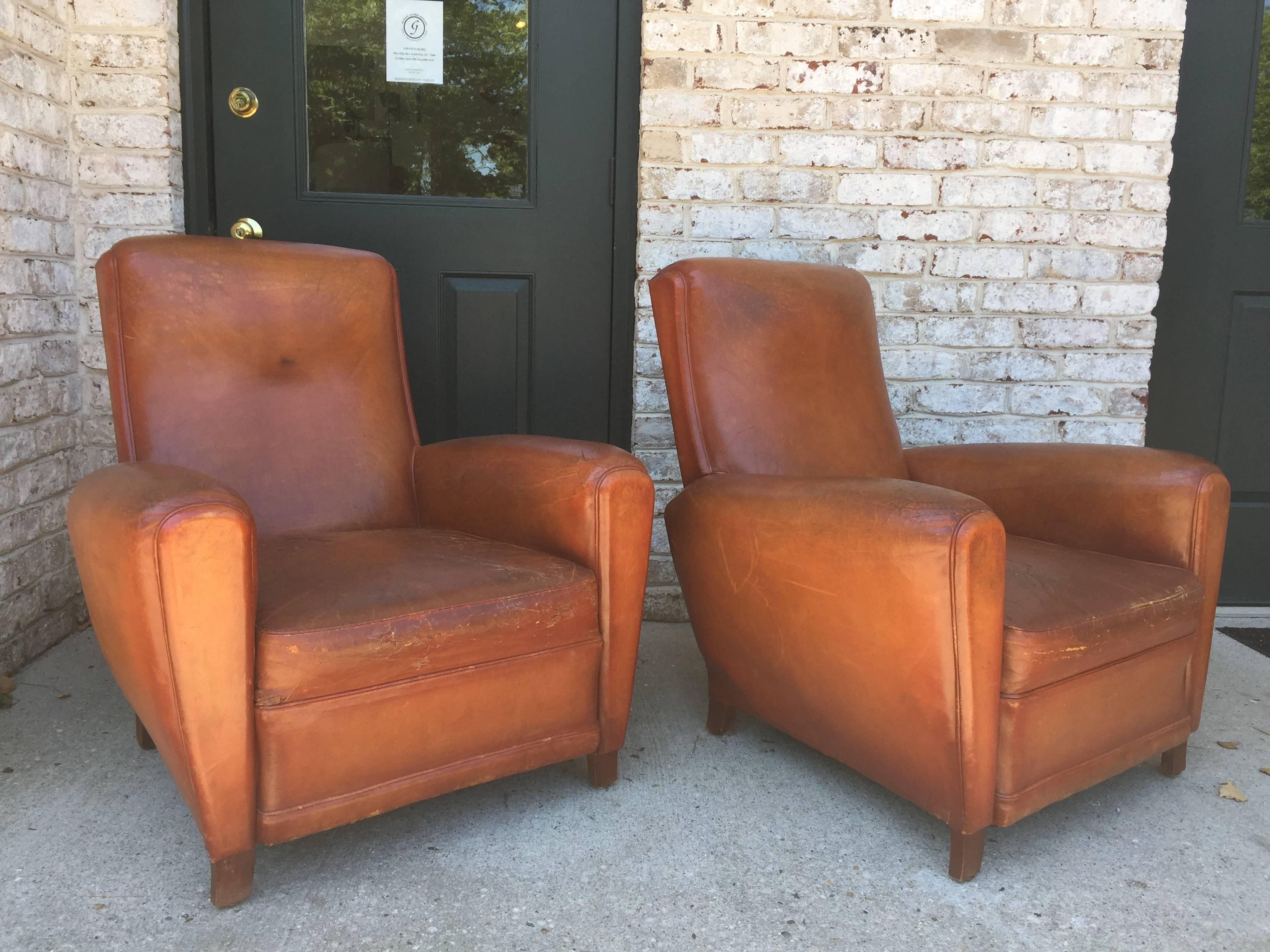 These all original French deco armchairs in beautiful worn and distressed leather. These beauties are extremely comfortable and you sink right in to them.