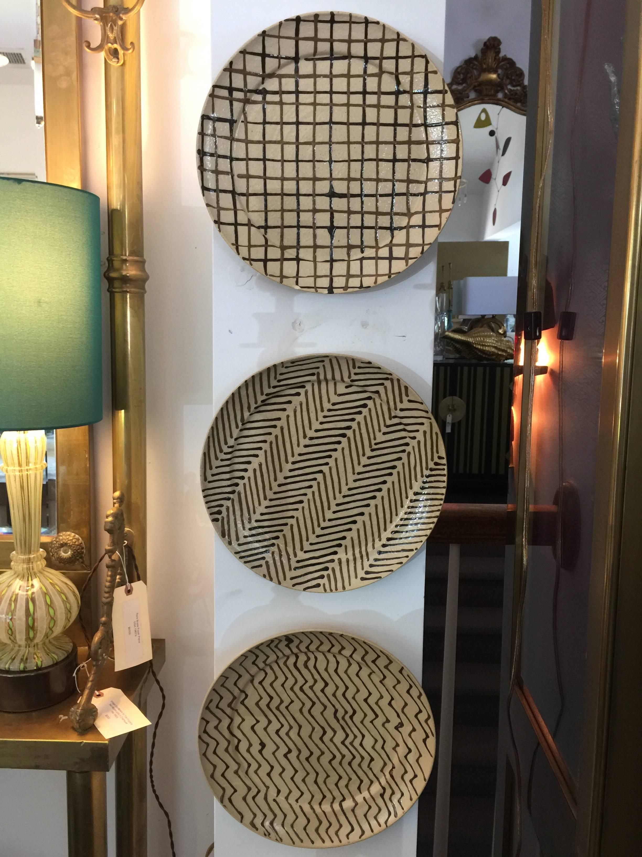 Each hand-painted plate is work of art, displayed in our showroom hung in a row. We have seven total - pictured are six unique designs. The seventh plate is a repeat. 

My Hamilton confirmed to us that these plates were created prior to 1977 when he