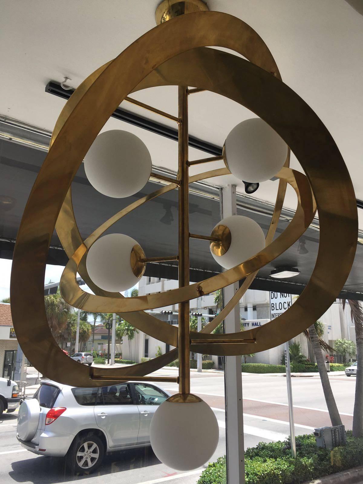 Contemporary Saturn's Rings Chandelier in Brass and Frosted Globes