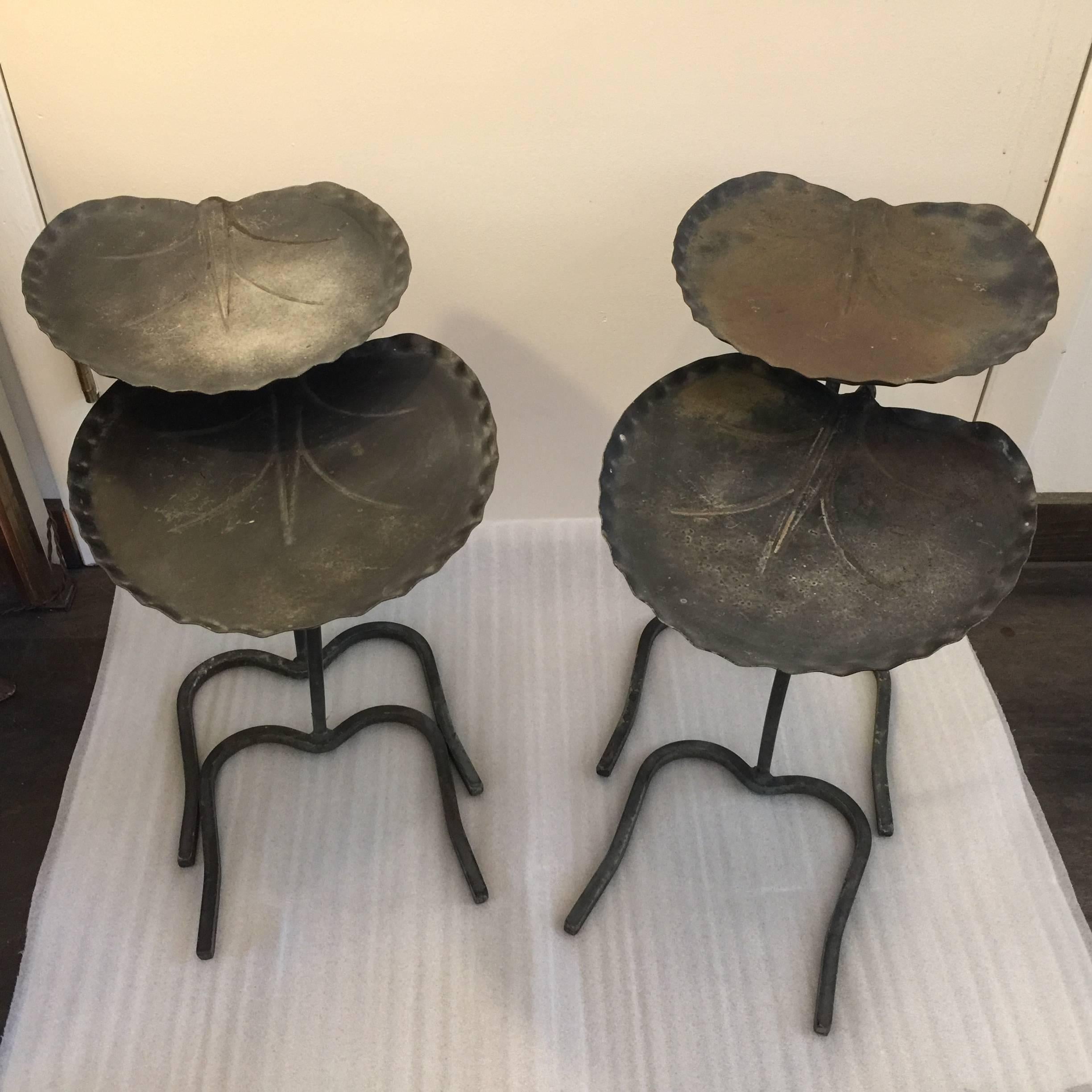 Lovely aged and worn to perfection nesting tables by Salterini, famed garden furniture designer. Each set nests perfectly and these are two sets available.

Measure: Taller table 20.5 inches tall, 12.5 inches diameter
Lower table 18.5 inches