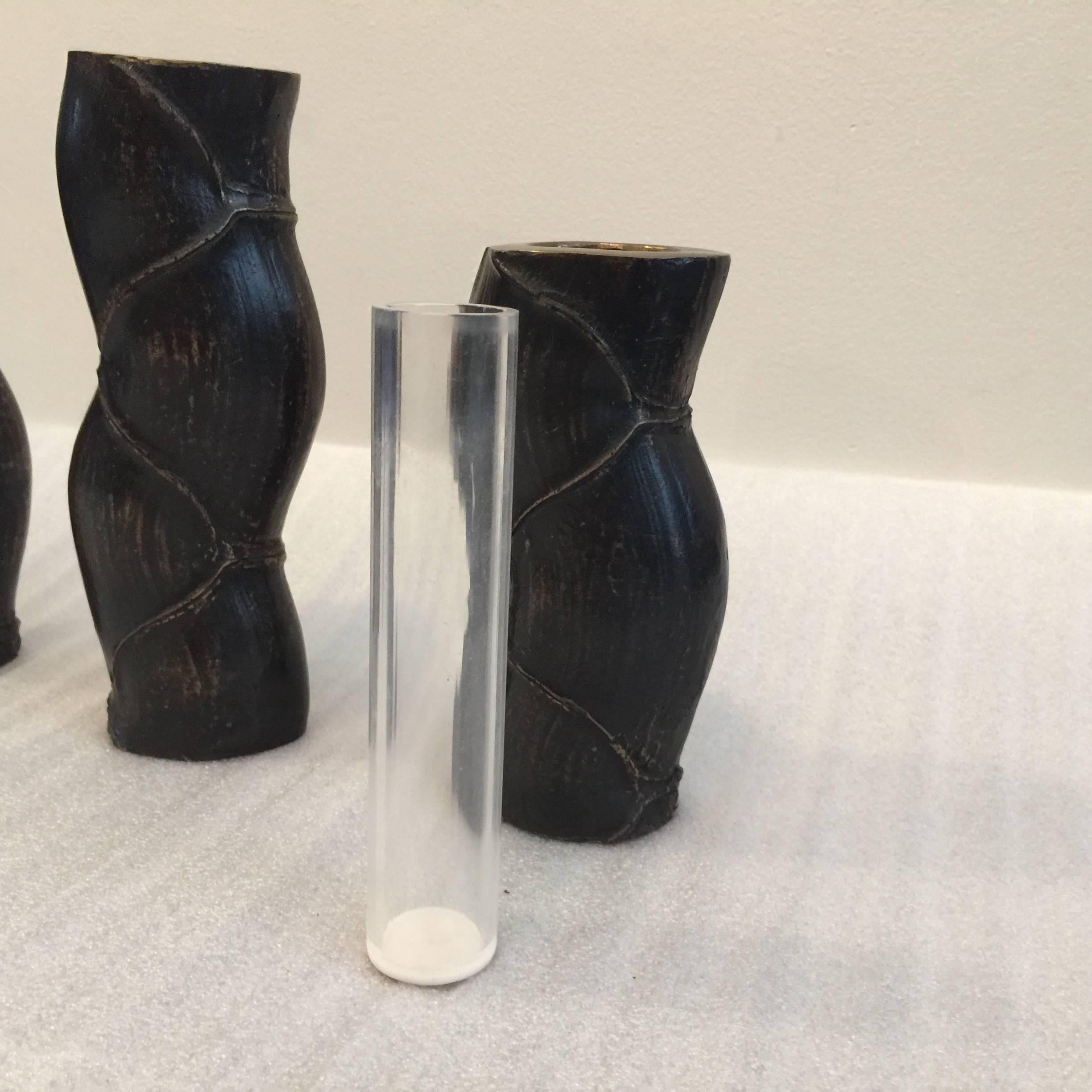 Finely cast bronze, these Japanese bud vases in faux bamboo design come with acrylic insulator to hold water for fresh flowers. These are heavy bronze sculptures/ table elements.

In descending sizes.

Tallest: 9.75 inches tall, 2.75 inches