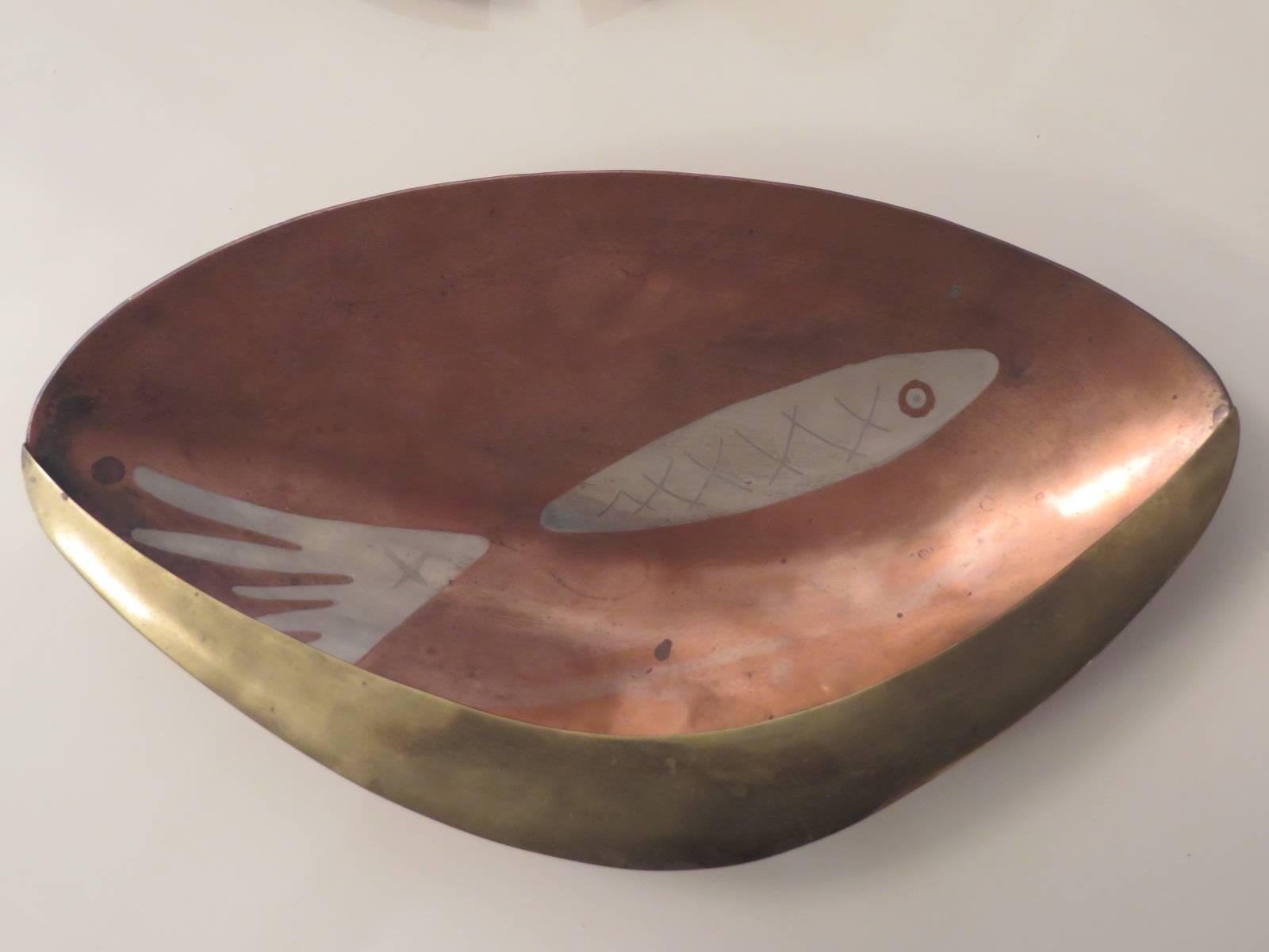 Hand-wrought, copper and silver shell bowl by Los Castillo, Mexico. Supported by three ball feet.
